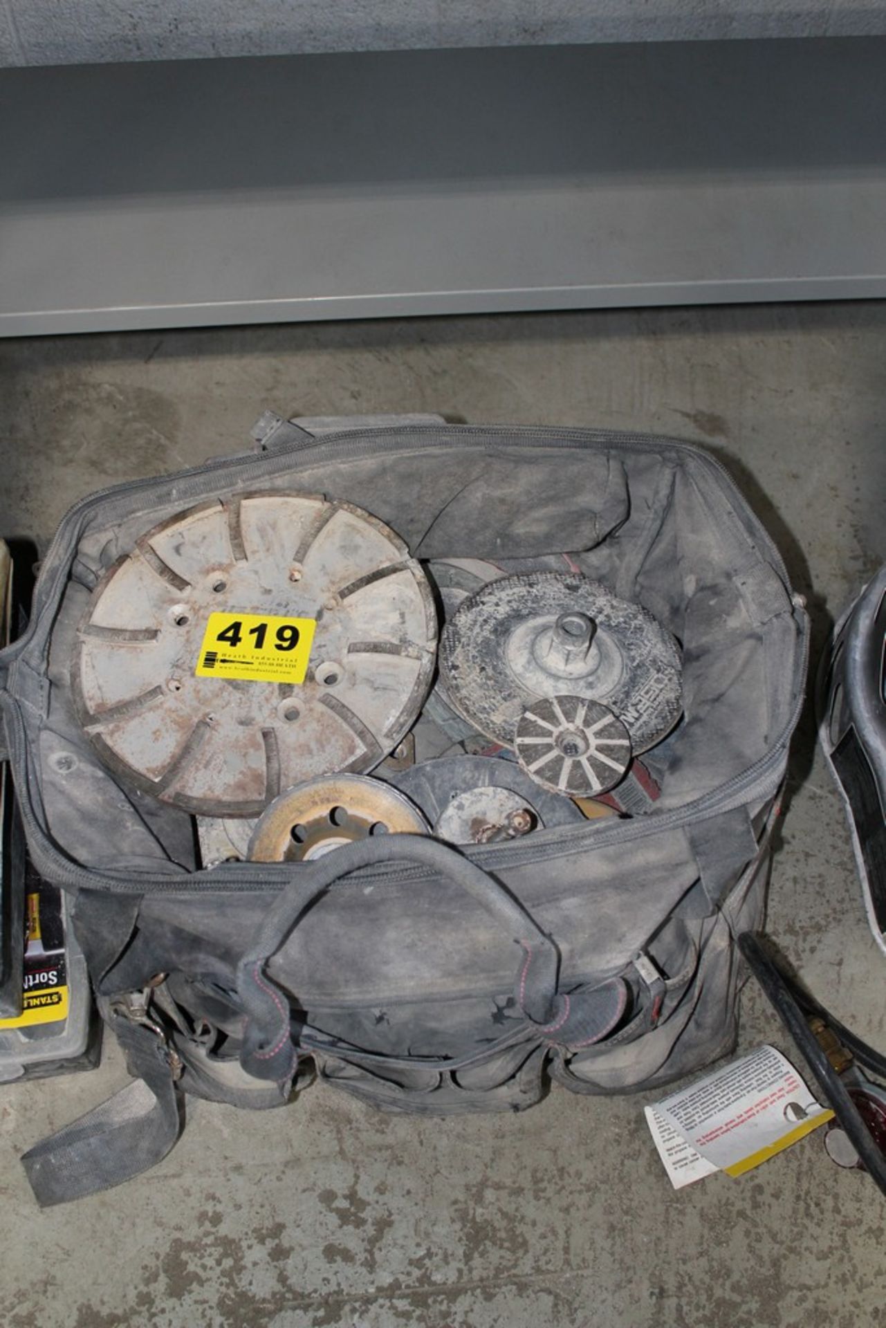 LARGE ASSORTMENT OF GRINDING WHEELS IN TOOL BAG