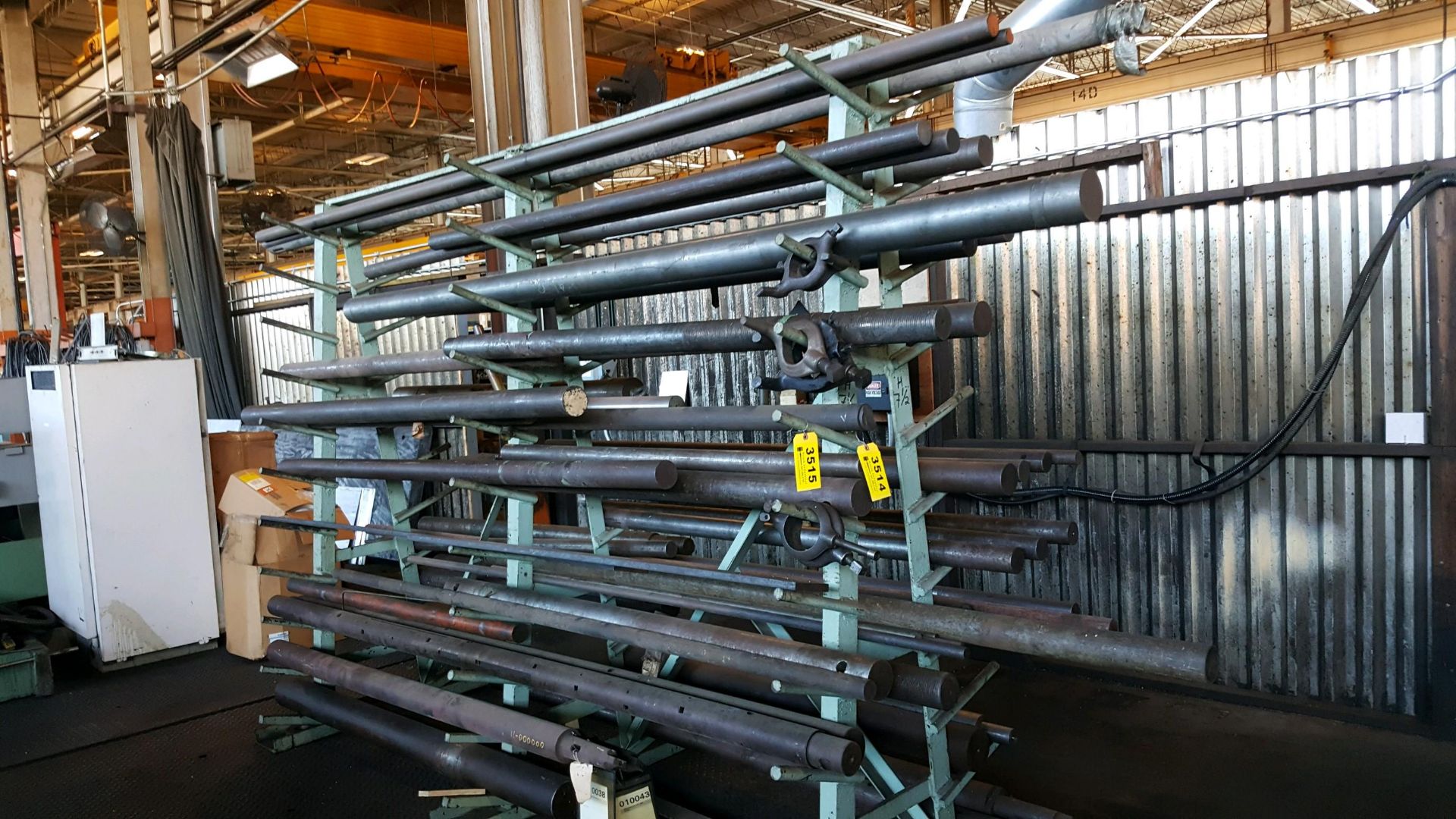 LARGE QUANTITY OF SOLID STEEL BARS ON RACK