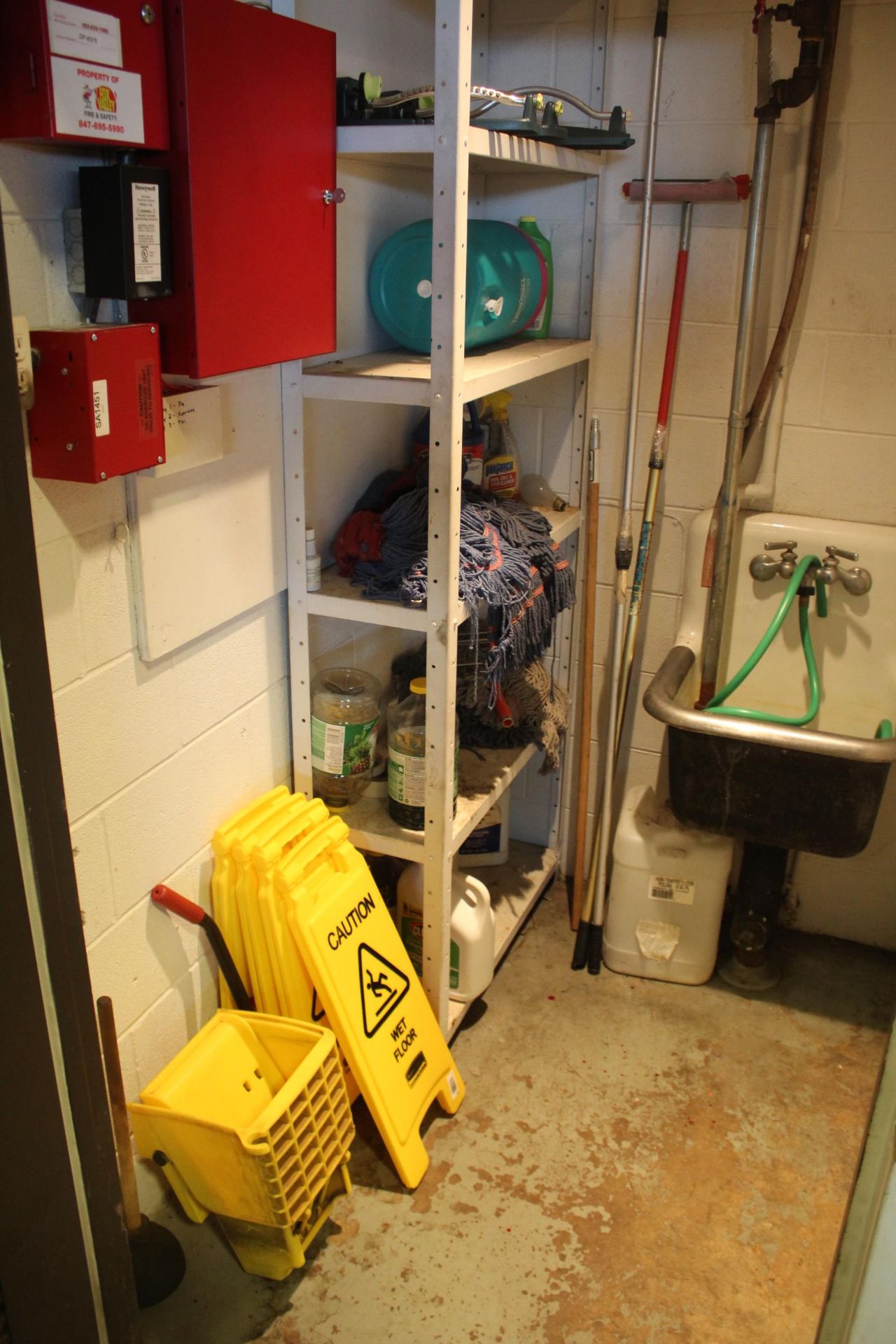 CONTENTS OF SUPPLY ROOM: MOP BUCKETS & HEADS, SPRINKLERS, ETC (NO FIRE RELATED EQUIPMENT)