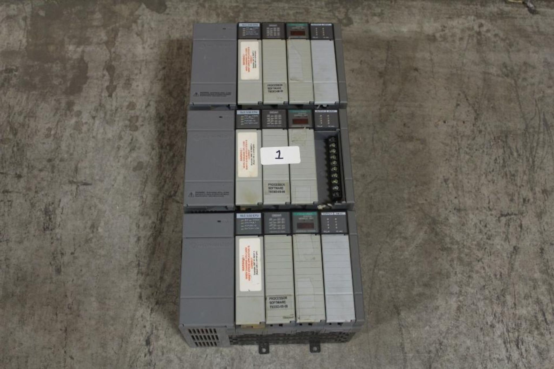 (Lot of 3) Allen-Bradley 1746-A4 Rack w/ 1746-P1 Power Supply, SLC 5/02 Processor, and Various Cards