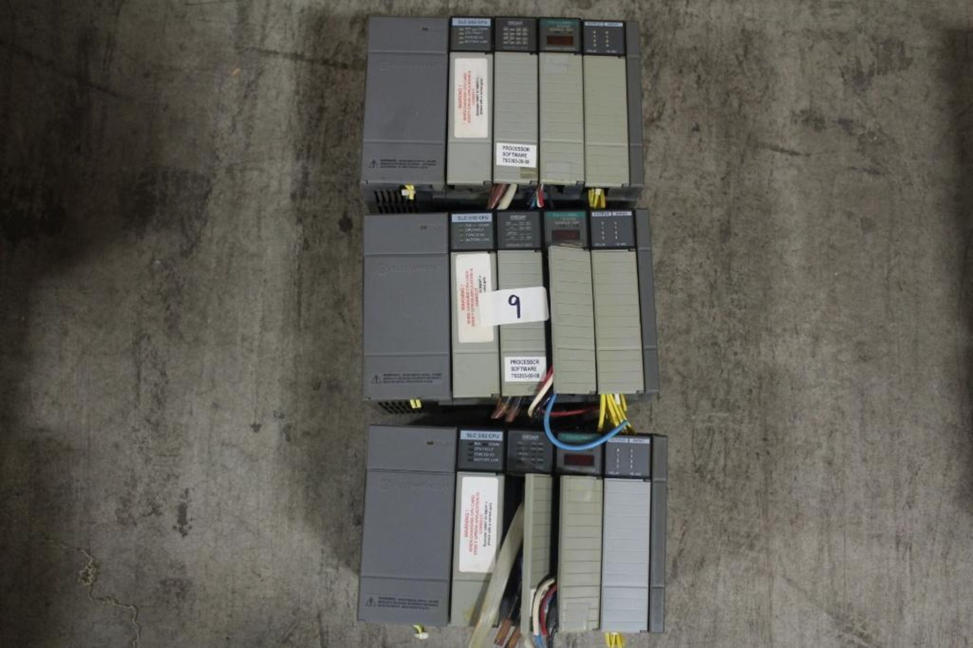 (Lot of 3) Allen-Bradley 1746-A4 Rack w/ 1746-P1 Power Supply, SLC 5/02 Processor, and Various Cards