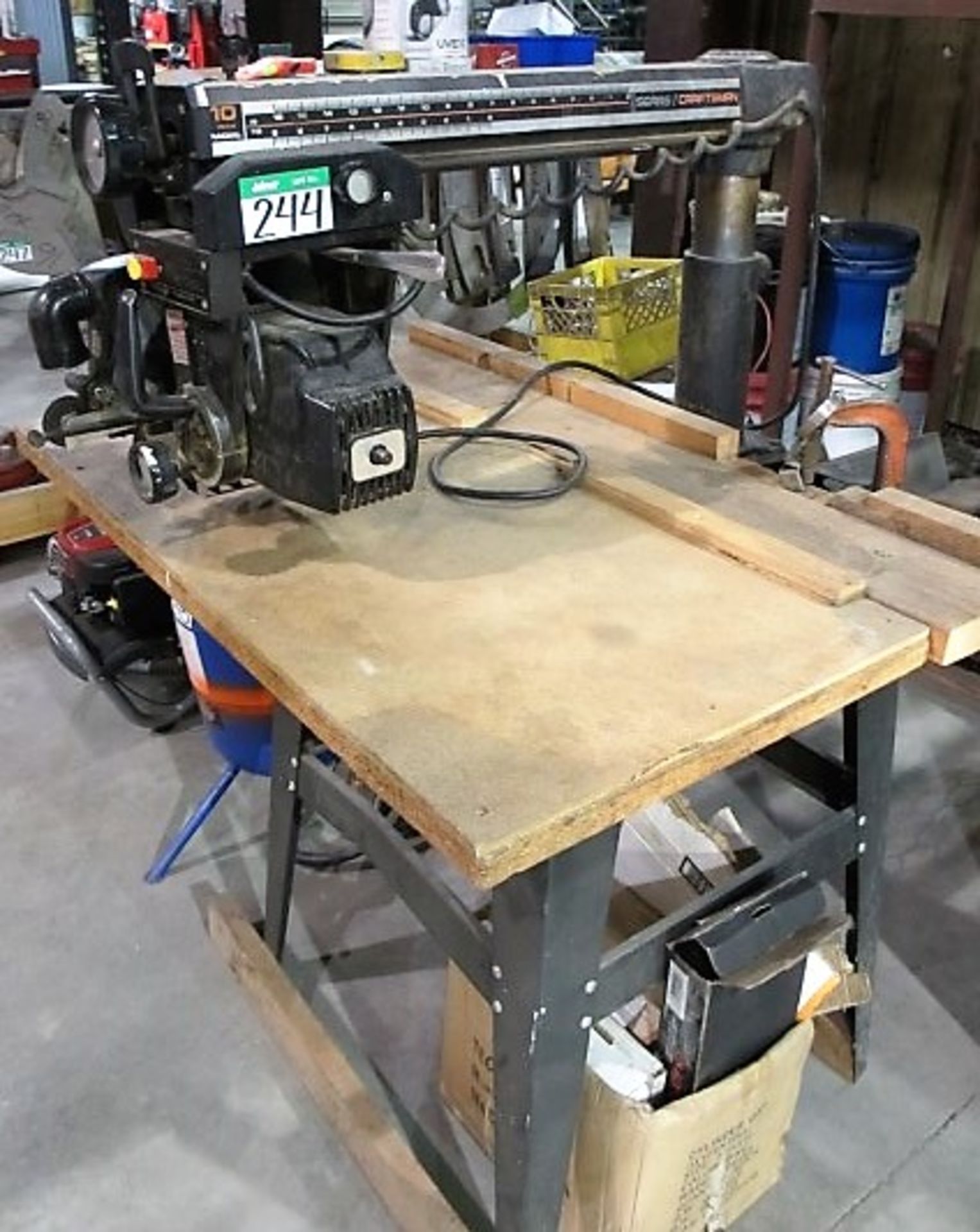 L1: CRAFTSMAN 10IN RADIAL ARM SAW, BOX OF ASST’D ATTACHMENTS