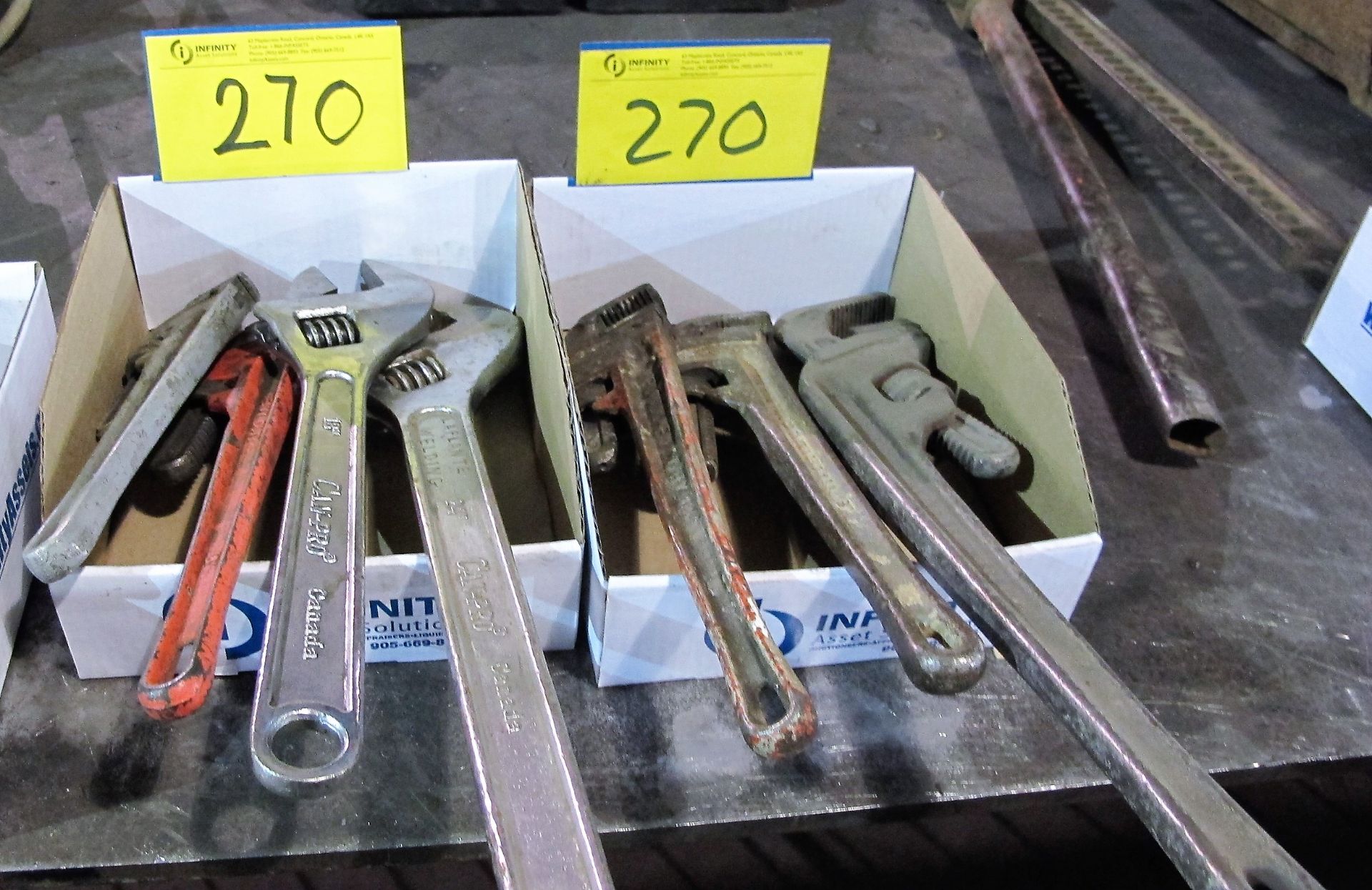 LOT OF (2) BOXES OF PIPE AND LARGE ADJUSTABLE WRENCHES