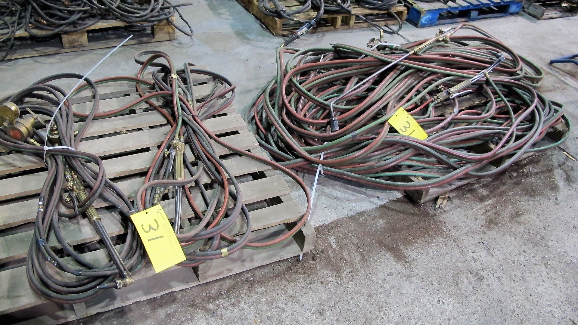 LOT OF (2) PALLETS W/ (4) TORCHES, REGULATORS, HOSES