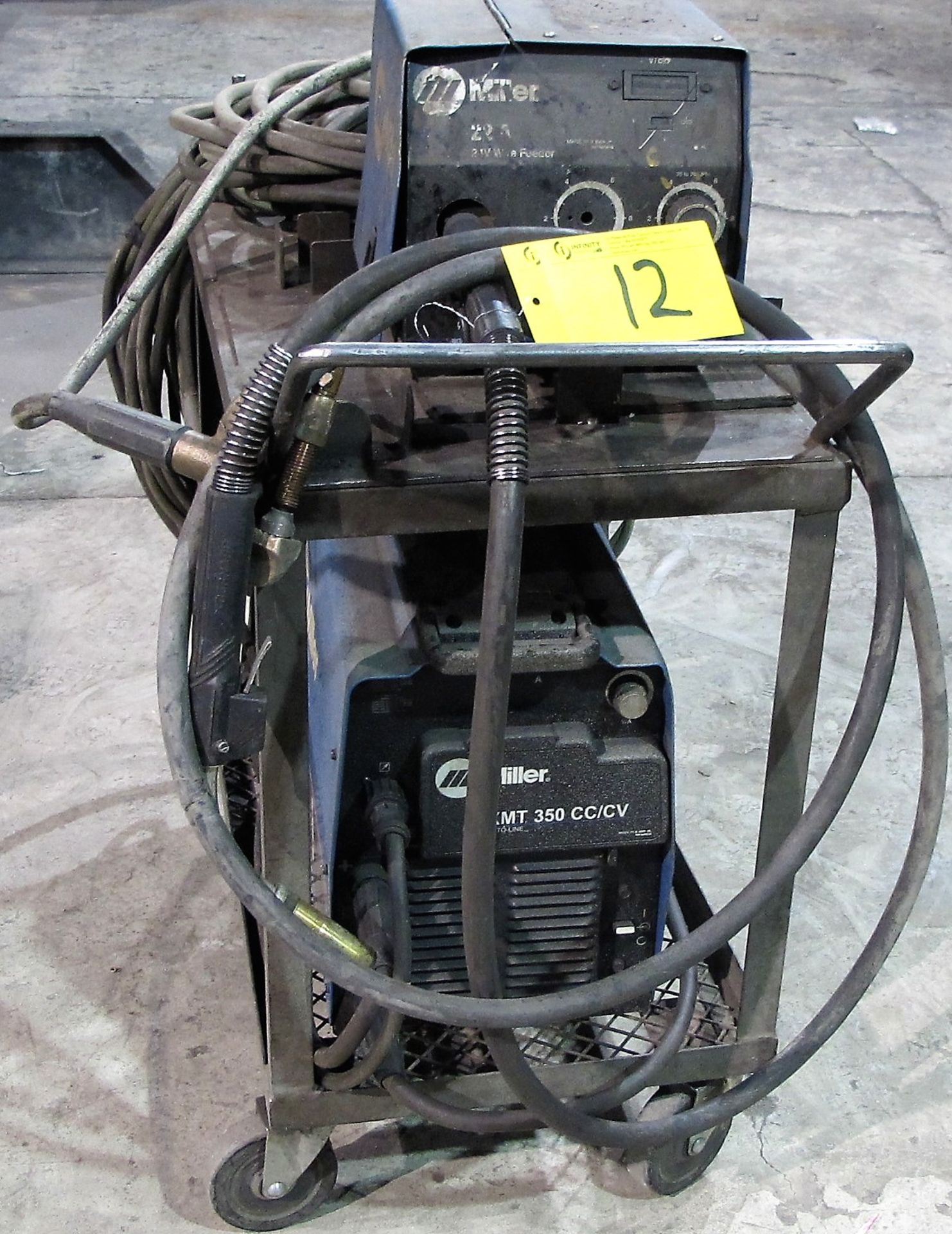 MILLER XMT 350 CC/CW WELDER, S/N LH160462A W/ MILLER 22A WIRE FEEDER, CABLES & CART