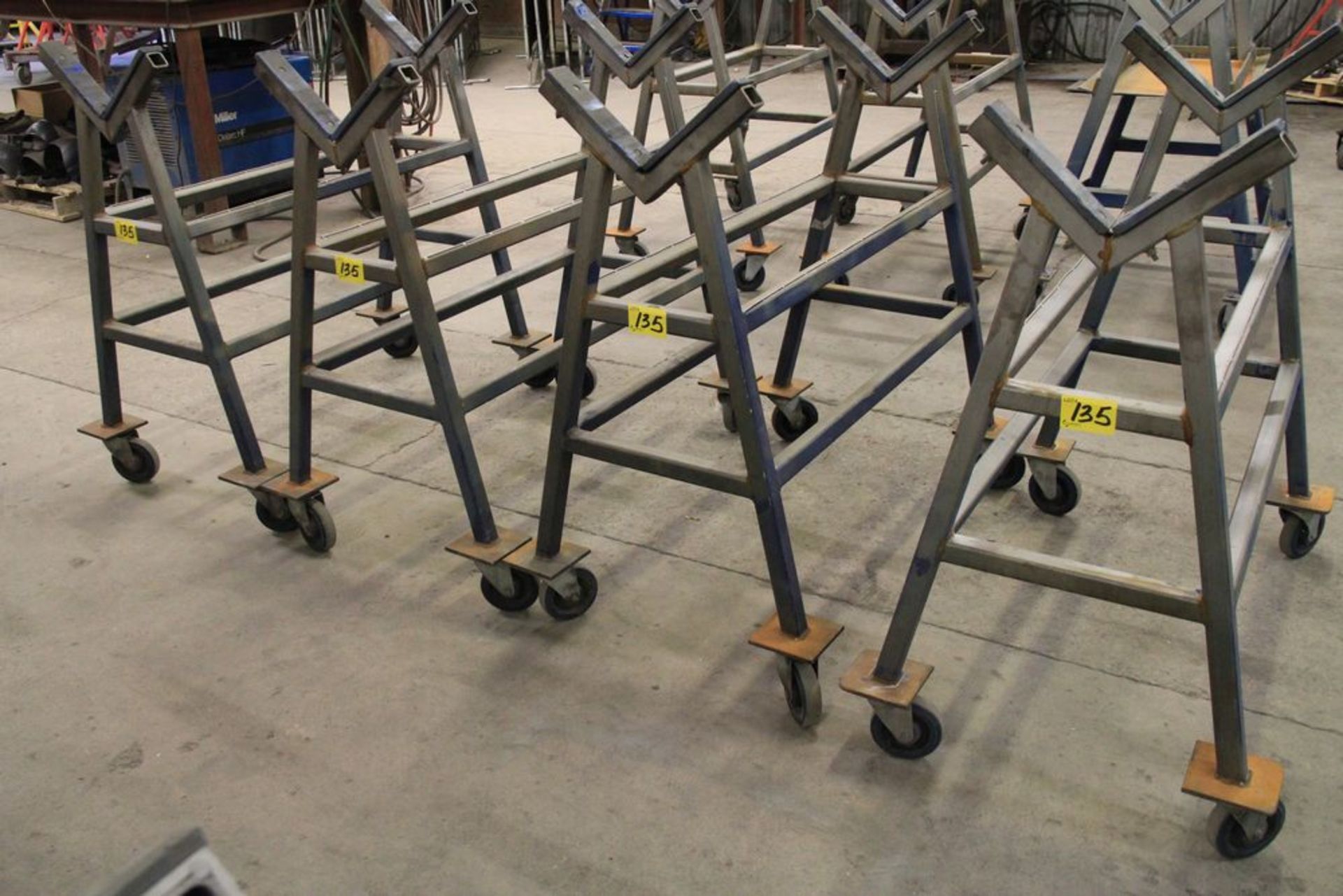 LOT OF (4) STEEL PIPE STANDS ON CASTORS, 42" WIDE