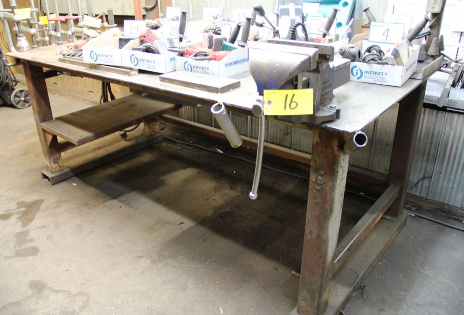 4' X 8' STEEL WORK TABLE C/W RECORD 8" BENCH VISE & OVERHEAD LIGHTS