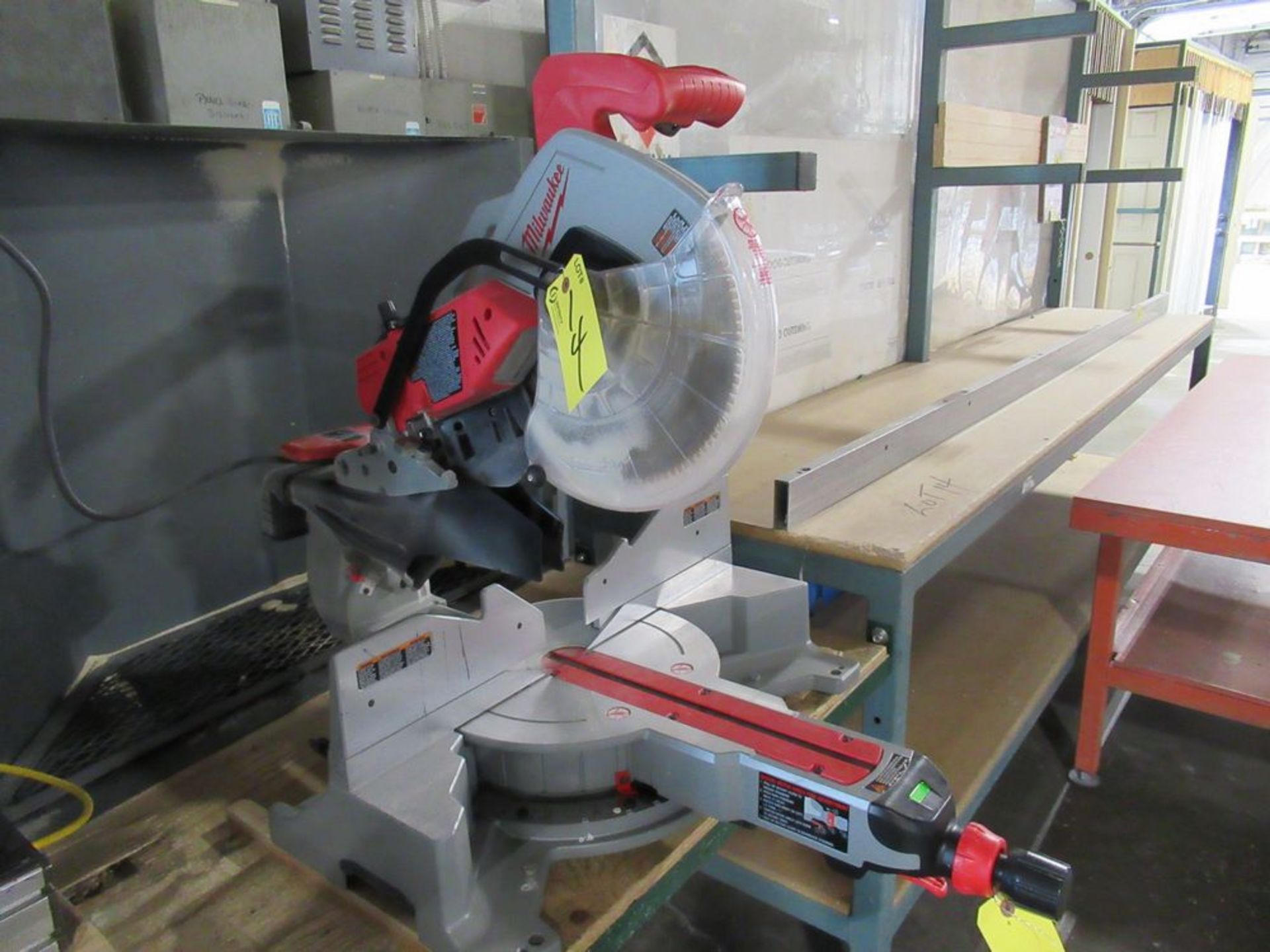 MILWAUKEE CAT# 6955-20 HD 12" COMPOUND SLIDING MITRE SAW, S/N B26-B917410381 W/ 24" X 10' TABLE