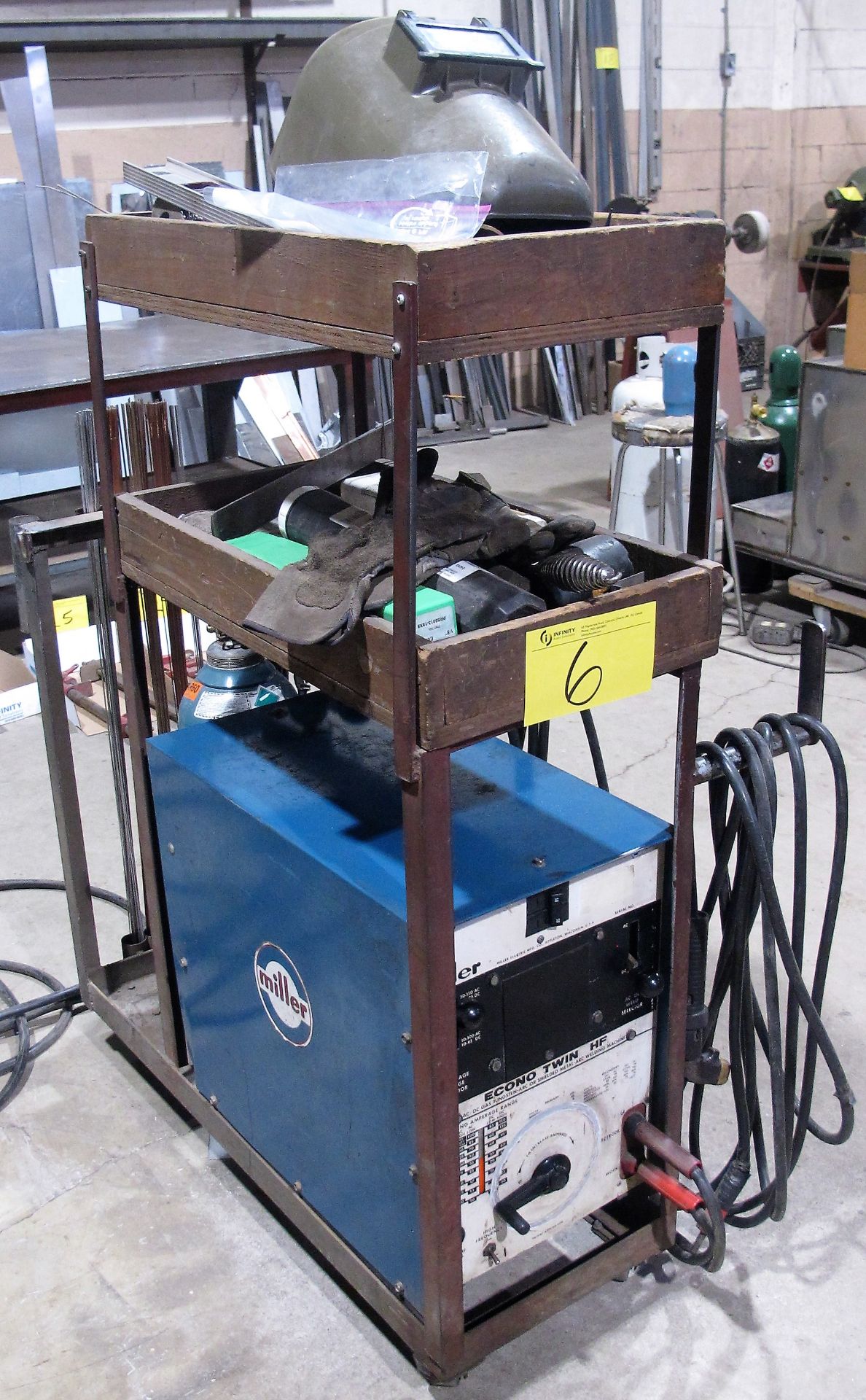 MILLER ECONO TWIN HF WELDER W/ CABLES, GUN, CART, ASST. SUPPLIES, ETC. (NO TANK)