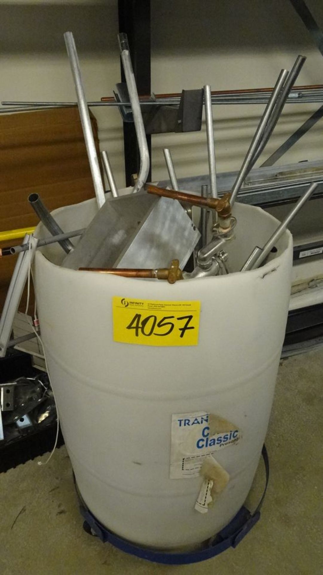 CONTENTS OF SCRAP IN PLASTIC DRUM AND ON STORAGE RACK (REUTER)
