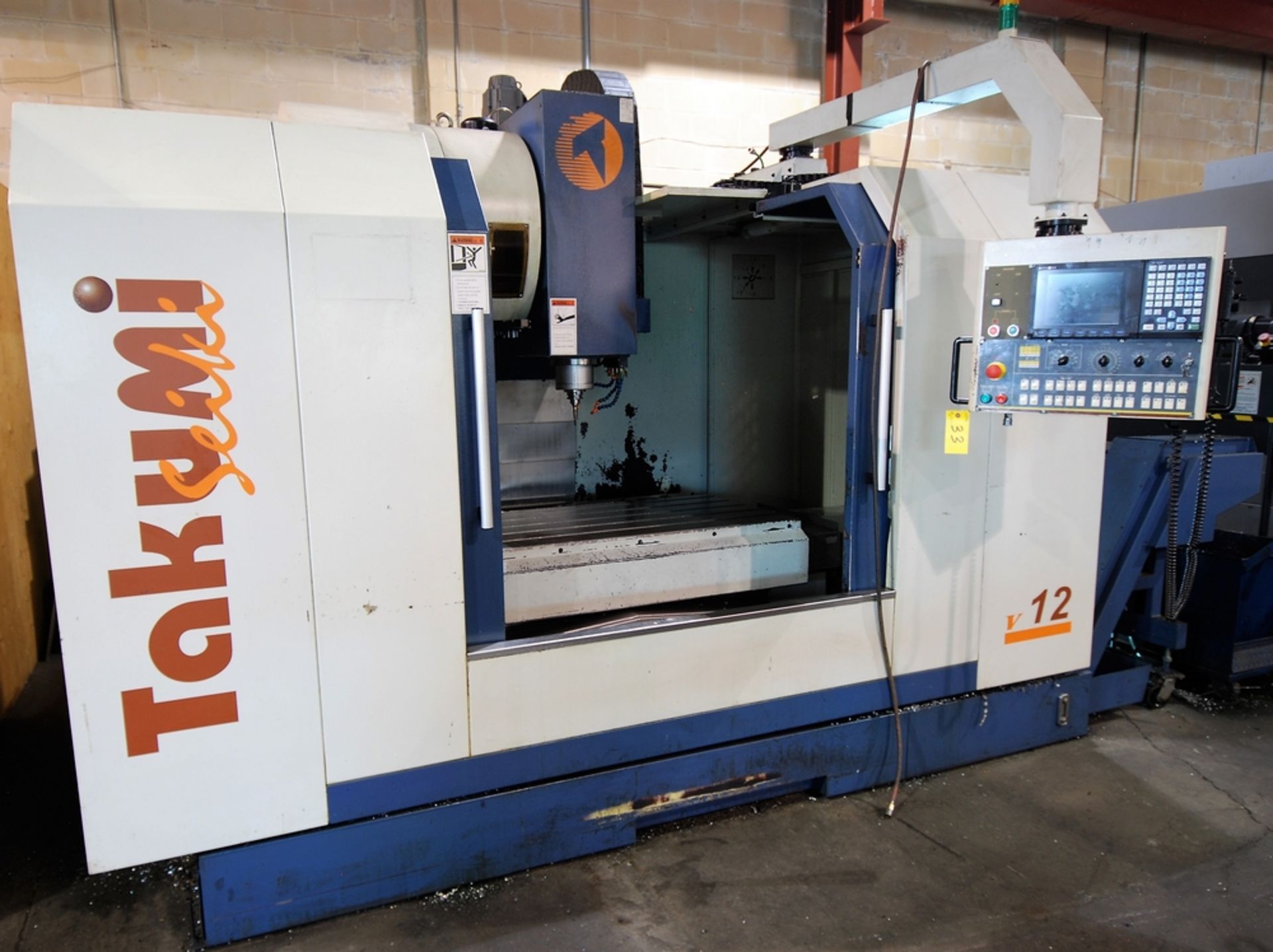 2008 TAKUMI V12 CNC VERTICAL MACHINING CENTER W/ MITSUBISHI CNC CONTROL, 53.1" X 27.2" TABLE,