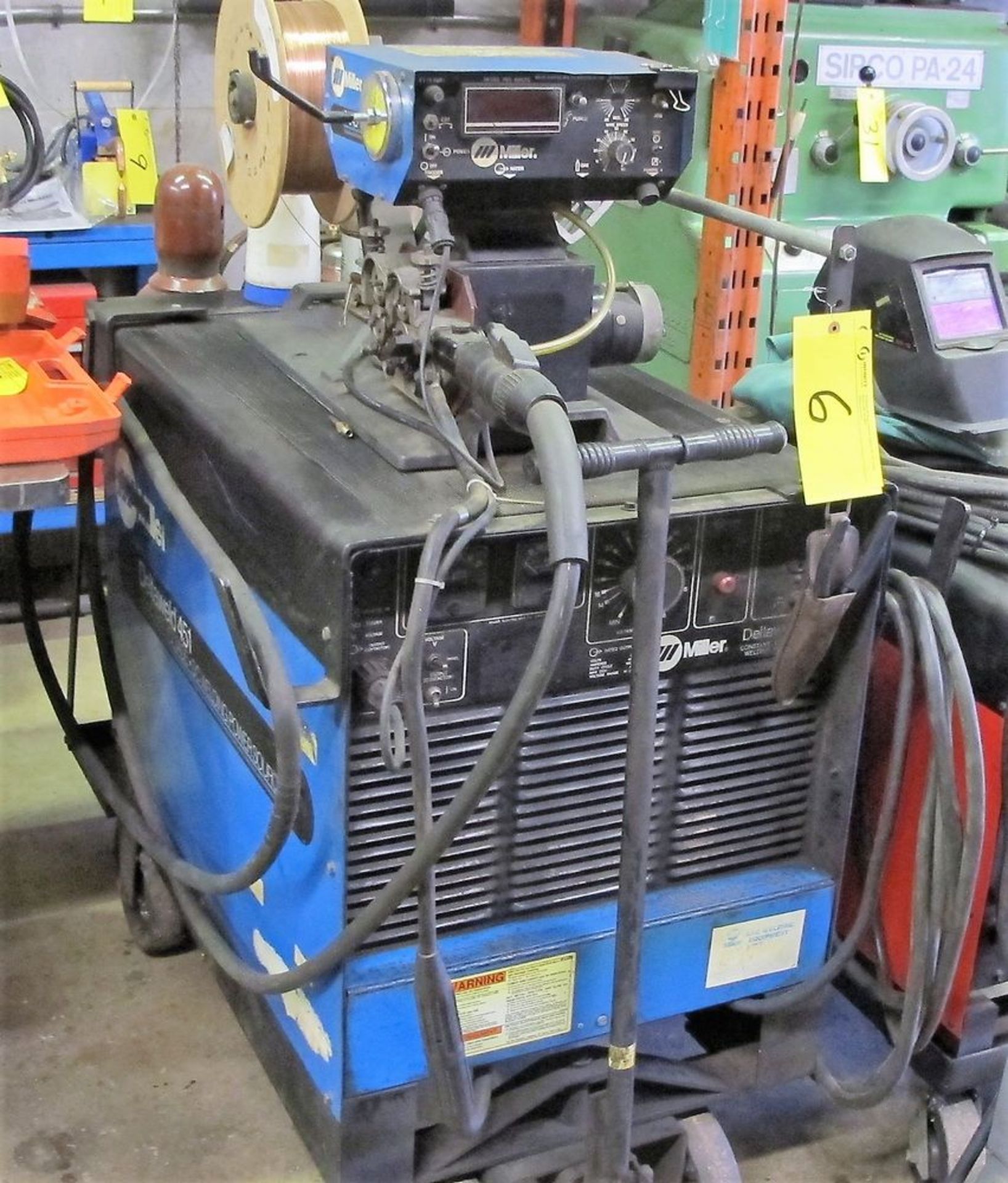 MILLER DELTAWELD 451 MIG WELDER W/ MILLER S-54D WIRE FEEDER, CABLES, CART AND (2) TANKS