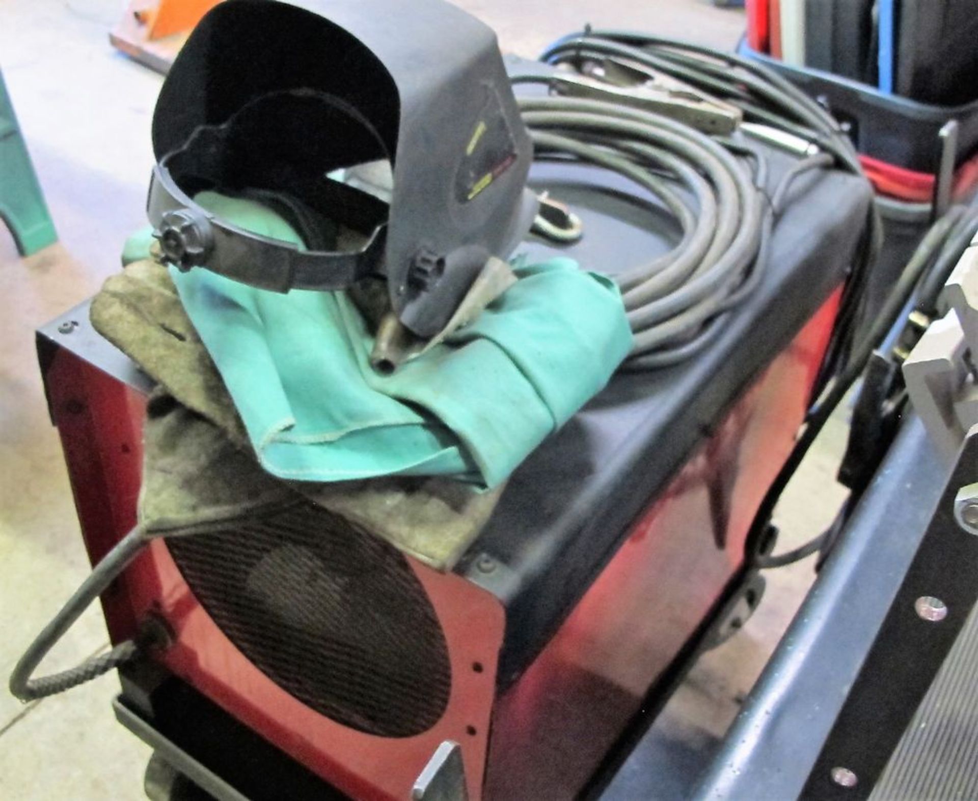 C250E AC/DC MIG WELDER W/ CABLES AND CART, MASK, CLOTHING - Image 3 of 3