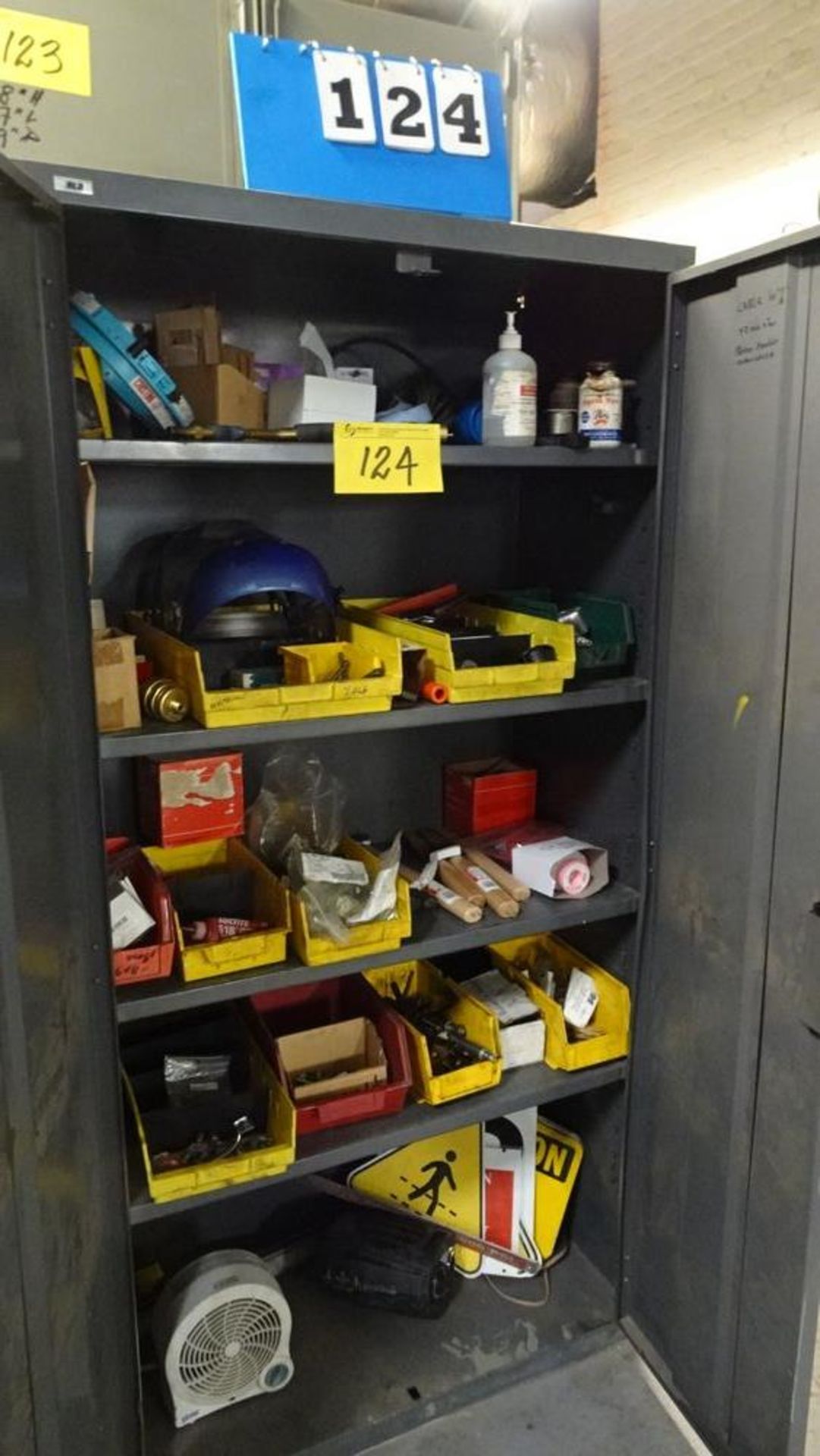 TWO DOOR STORAGE CABINET C/W ASSORTED CONTENTS (RIGGER FEE $25)
