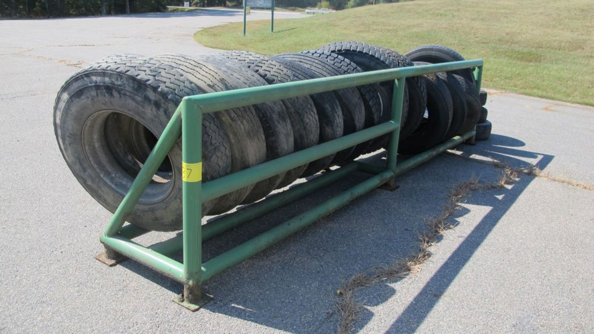 16' L TRANSPORT TIRE STORAGE RACK W/13 TRANSPORT TIRES (USED - NEW) (WAREHOUSE 30 - PARKING LOT)