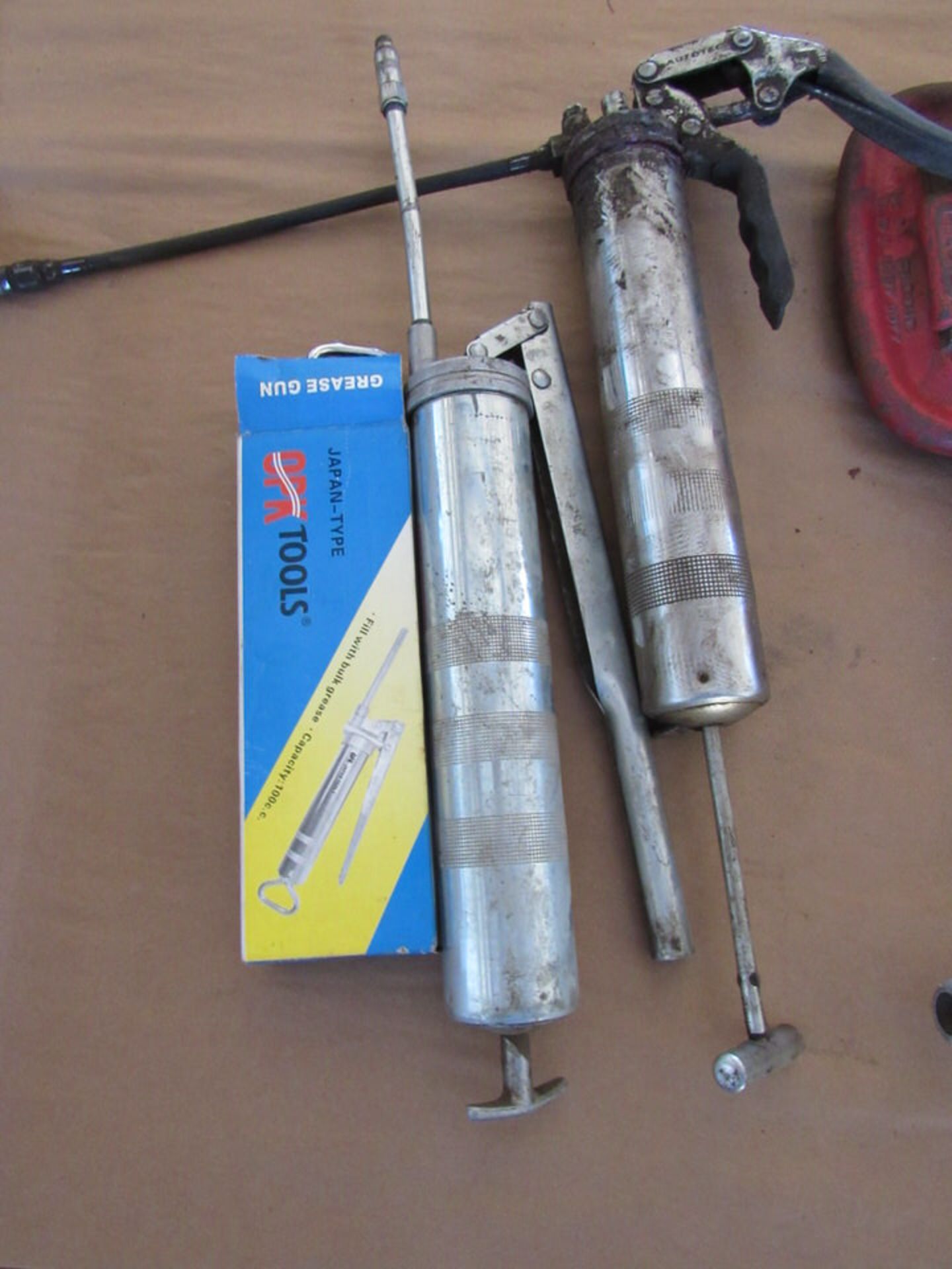 Three Grease Guns, Various Sizes