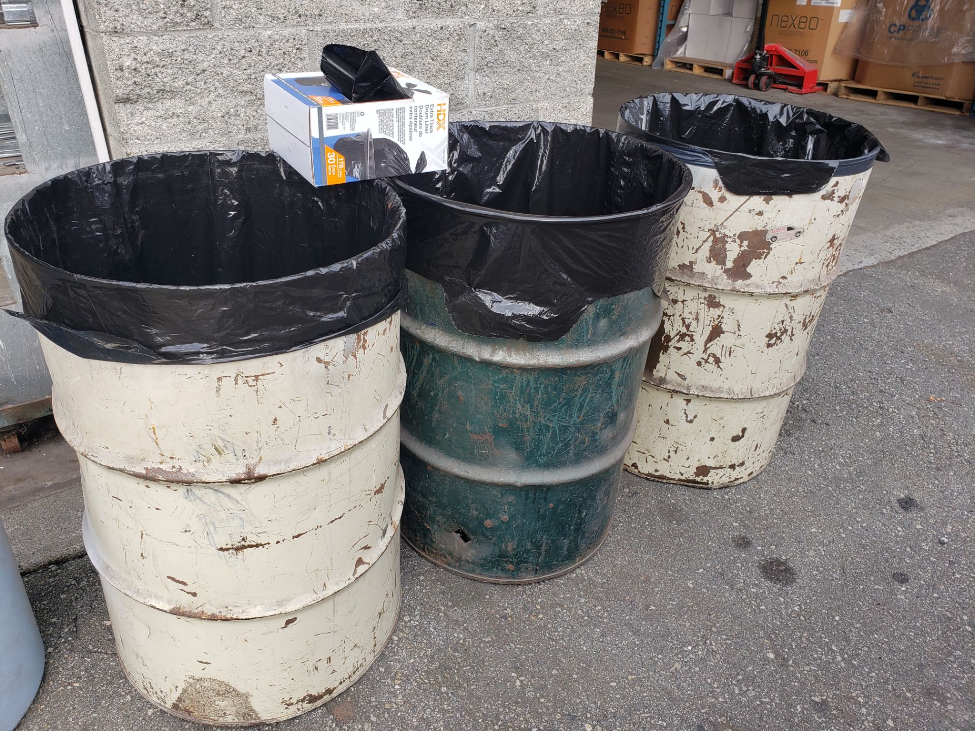 (3) 45 gallon drum waste cans w/ spare plastic garbage bags