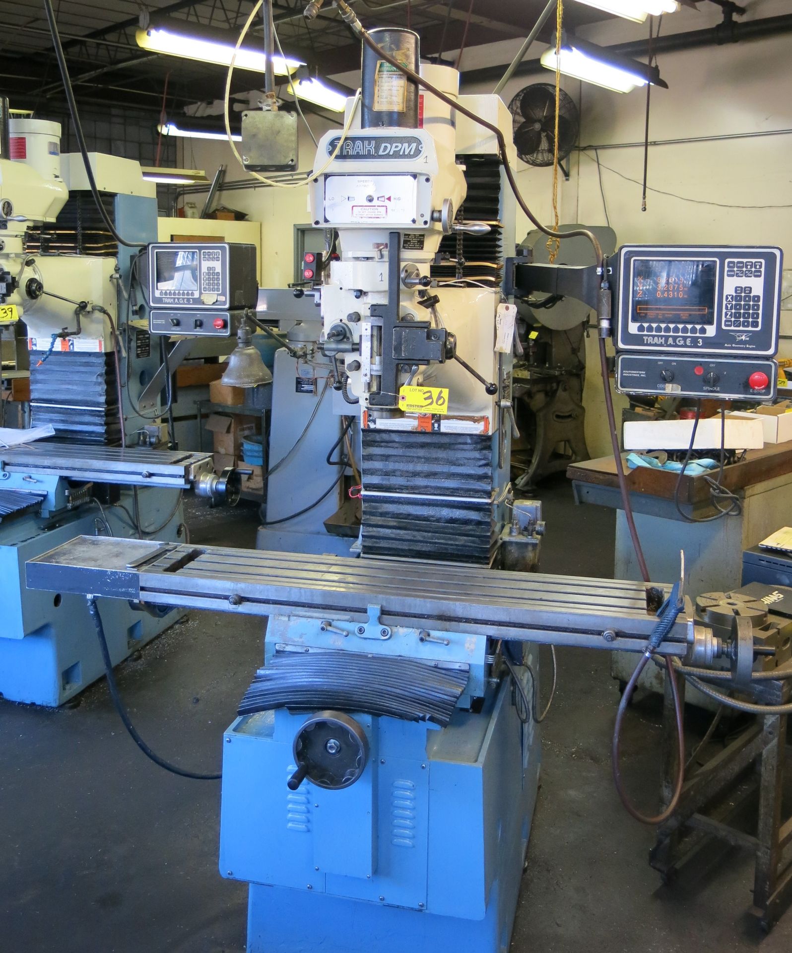 (1) TRAK CNC 3-AXIS VERTICAL MILLING MACHINE WITH APPROXIMATELY 50" T-SLOT TABLE, KURT POWER LOCK