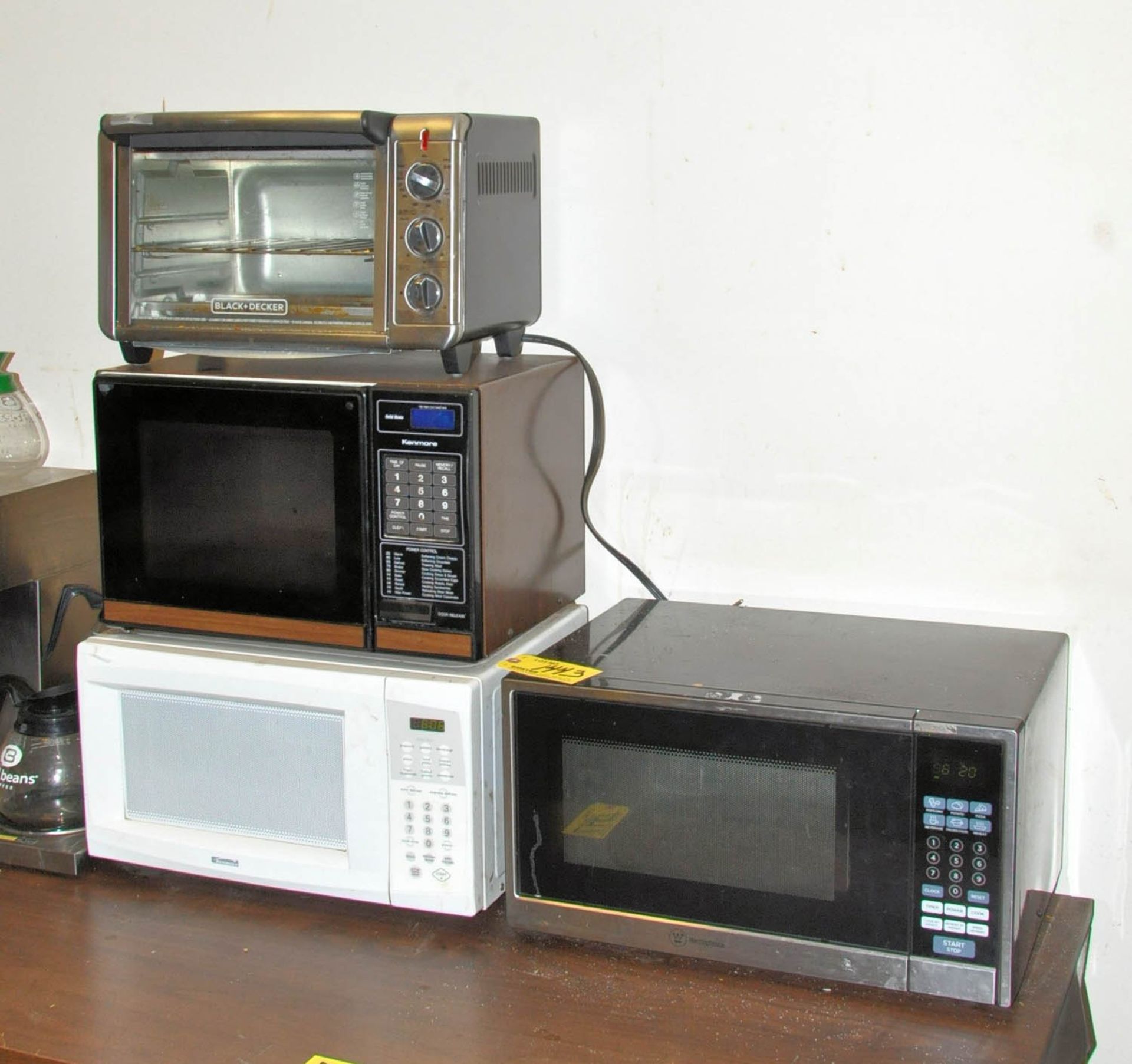 (4) MICROWAVE OVENS AND (1) TOASTER OVEN