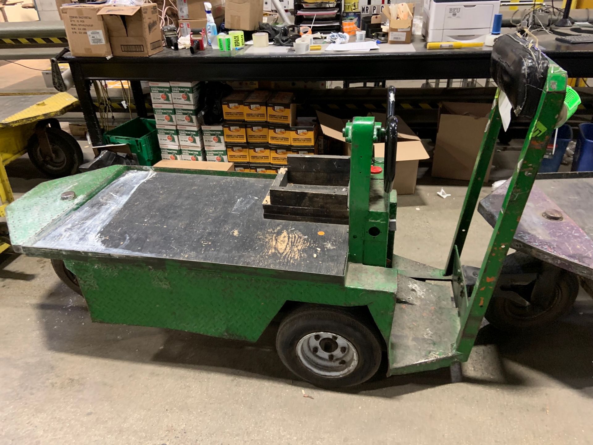 Tugger: single man electric 3 wheel cart. Make: Taylor Dunn. Model: series 100. Year: 1979