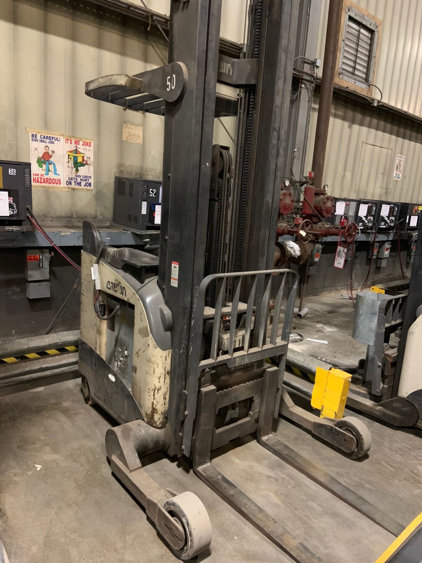 Forklift: Stand Up Electric Forklift. Make: Crown. Model: RR5220-45. S/N: 1A1247046. Year: 2001.
