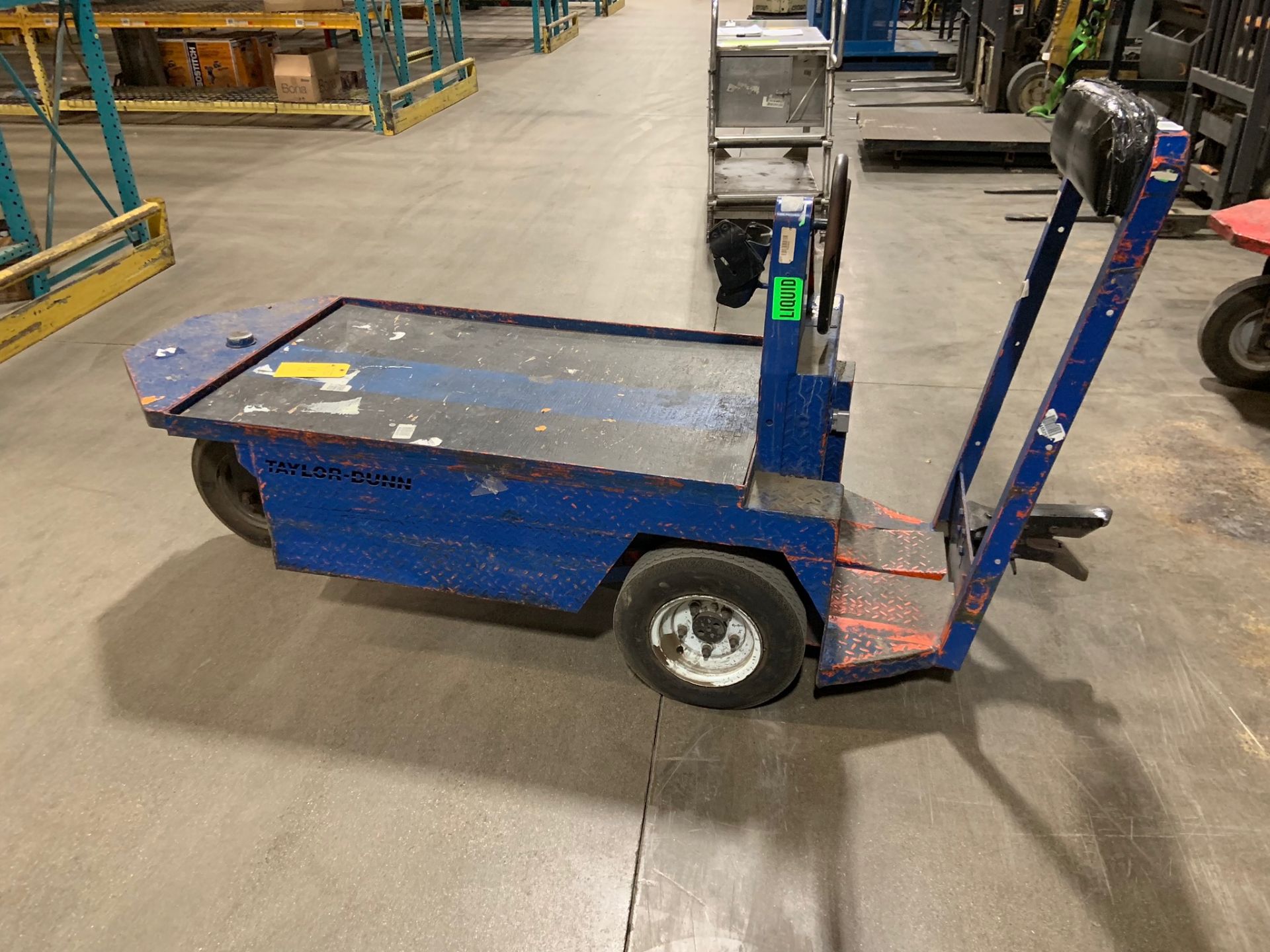 Tugger: single man electric 3 wheel cart. Make: Taylor Dunn. Model: 300 series. Year: 2003