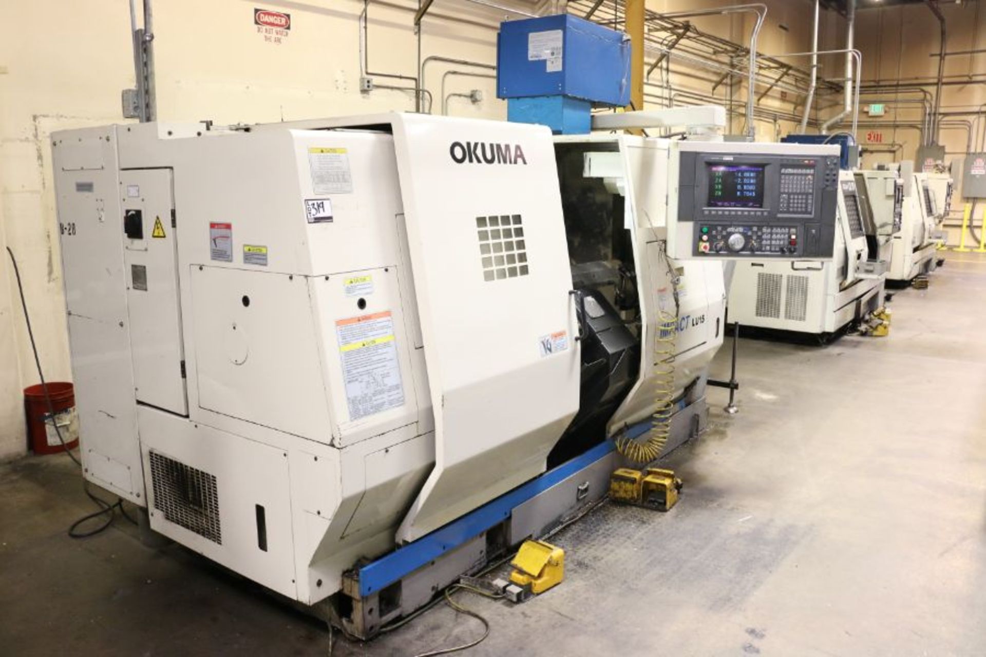 Okuma Impact LU-15 4-Axis, OSP-UI00L control, 10" 3 Jaw Chuck, 12 Position Upper & 8 Position - Image 3 of 12