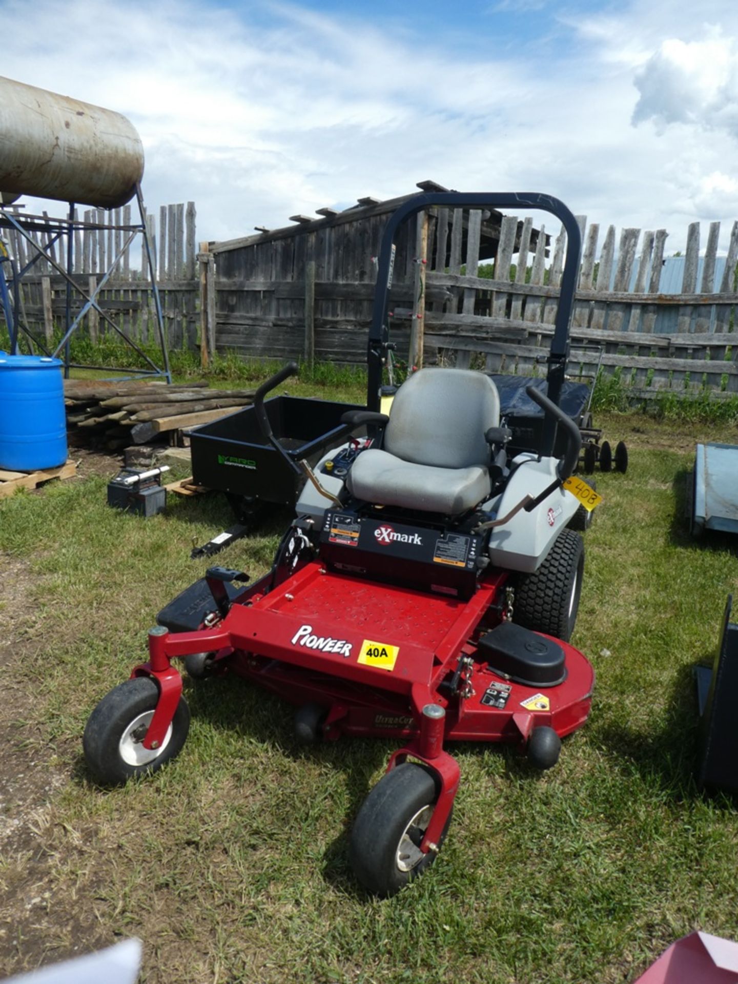 EXMARK PIONEER E SERIES ZERO TURN MOWER W/ 52" MOWING DECK, ROPS - 74.4 HRS23HP S/N 314607425