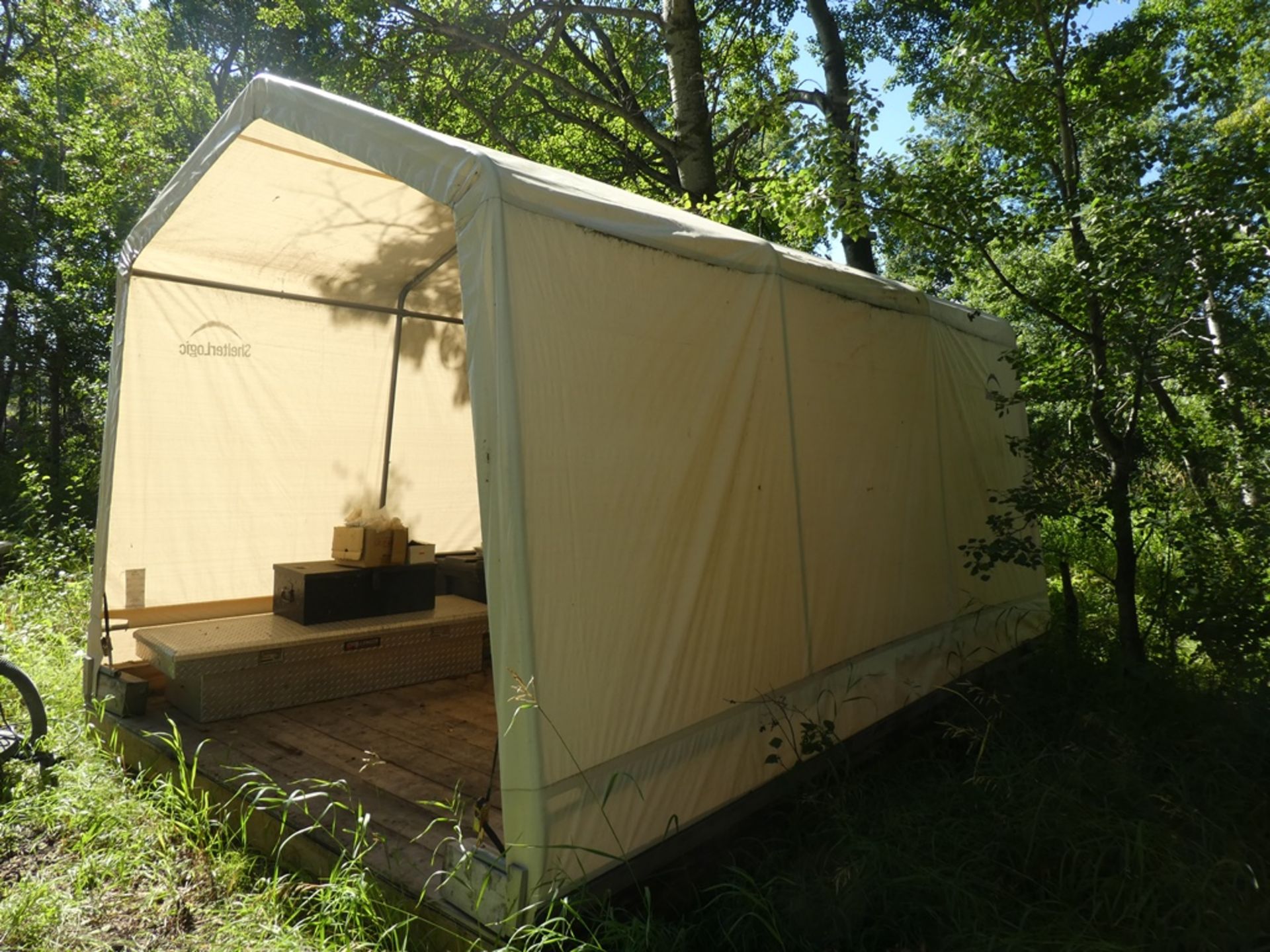 SHELTER LOGIC METAL FRAME TARP SHELTER 10'X15' S/N 081231 W/ SKIDDED WOOD FLOOR