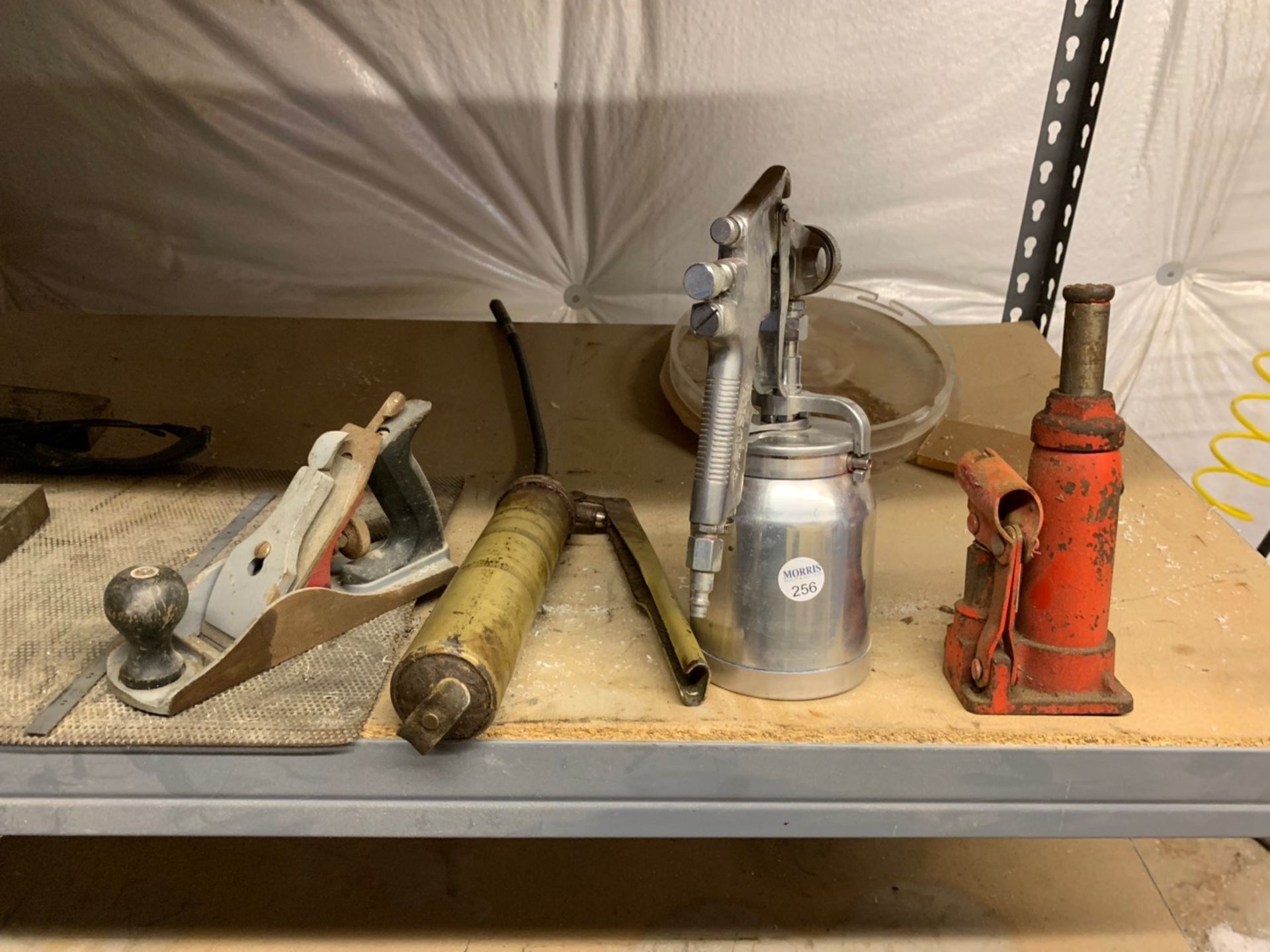 Assorted tools, planer, grease gun, paint gun, jack