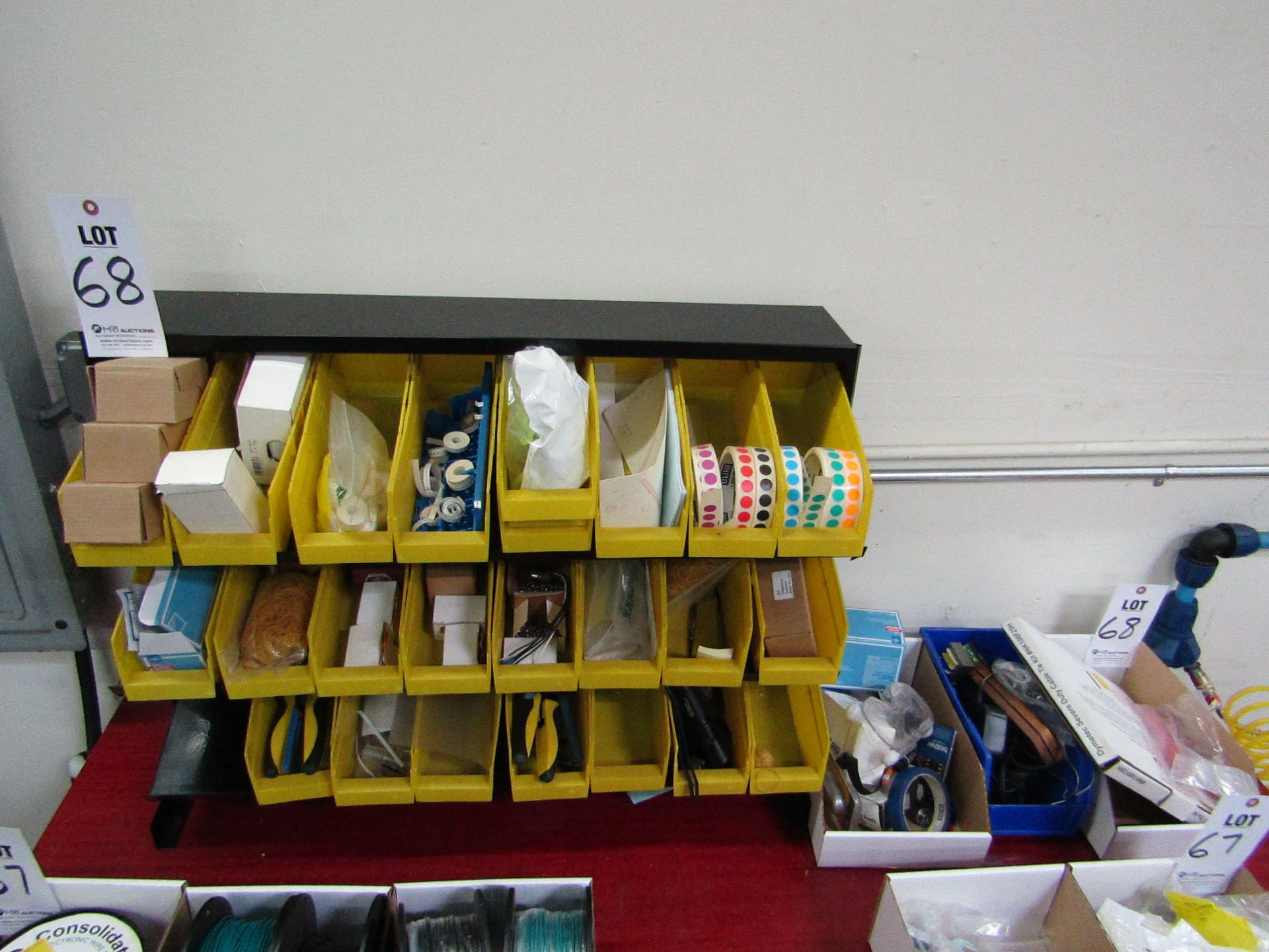 ORGANIZER RACK WITH YELLOW BOXES TO INCLUDE: MISC. ELECTRICAL, WIRE CUTTERS, STICKERS, DYMETEC TIE