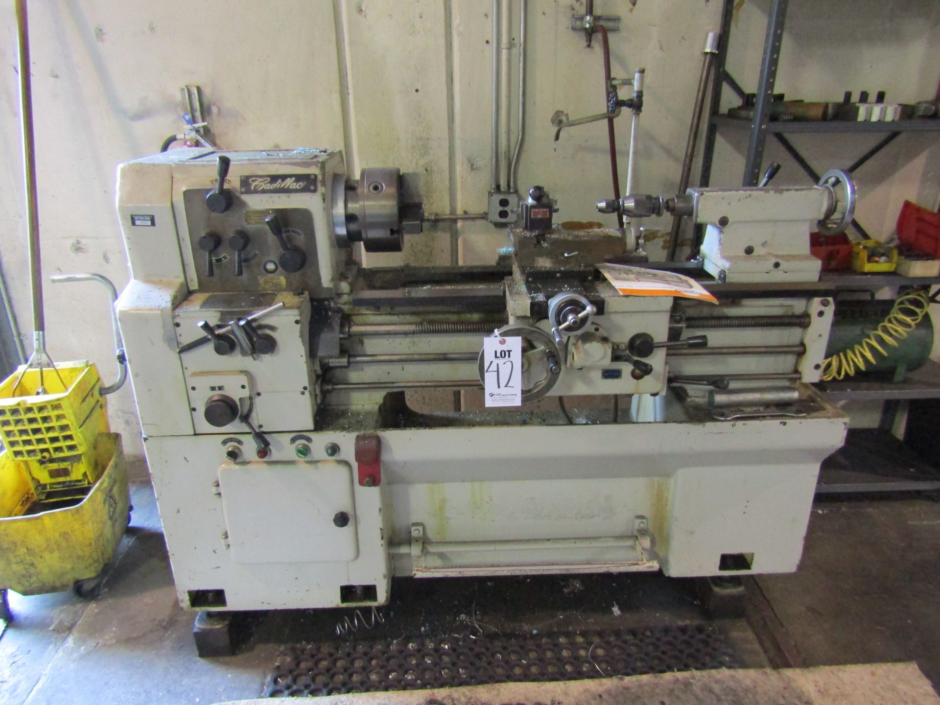 CADILLAC MANUAL SPINDLE LATHE, MODEL CM 1428. LOT TO INCLUDE SHELVING CONTENTS, LIVE CENTER, DRILLS,