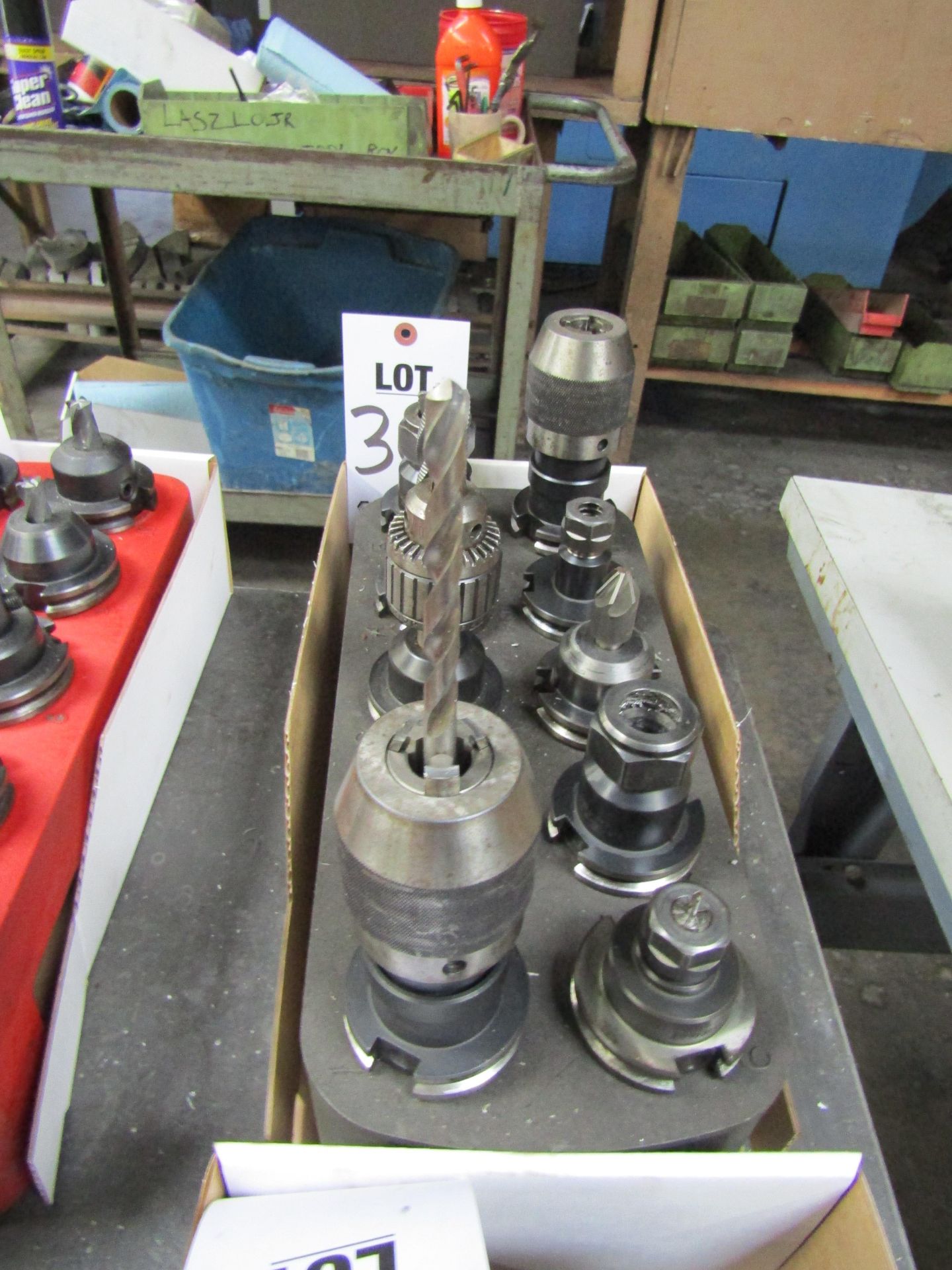 LOT TO INCLUDE: (10) 40T COLLET CHUCKS, MISC. BORING HEAD ATTACHMENTS, CUTTING TOOLS, COLLET CHUCK