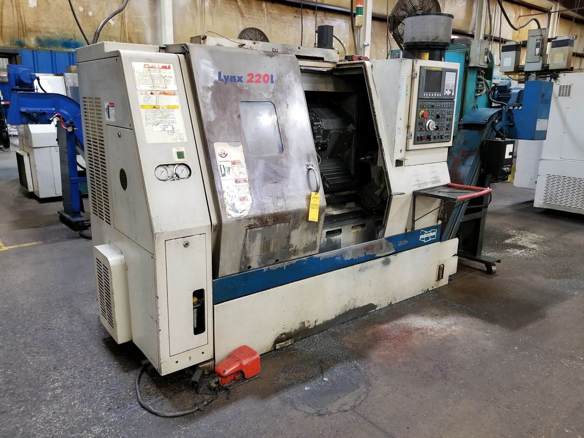 DOOSAN LYNX 220LC CNC TURNING CENTER; 12-POSITION TURRET, TURBO CHIP CONVEYOR, ROYAL FILTERMIST