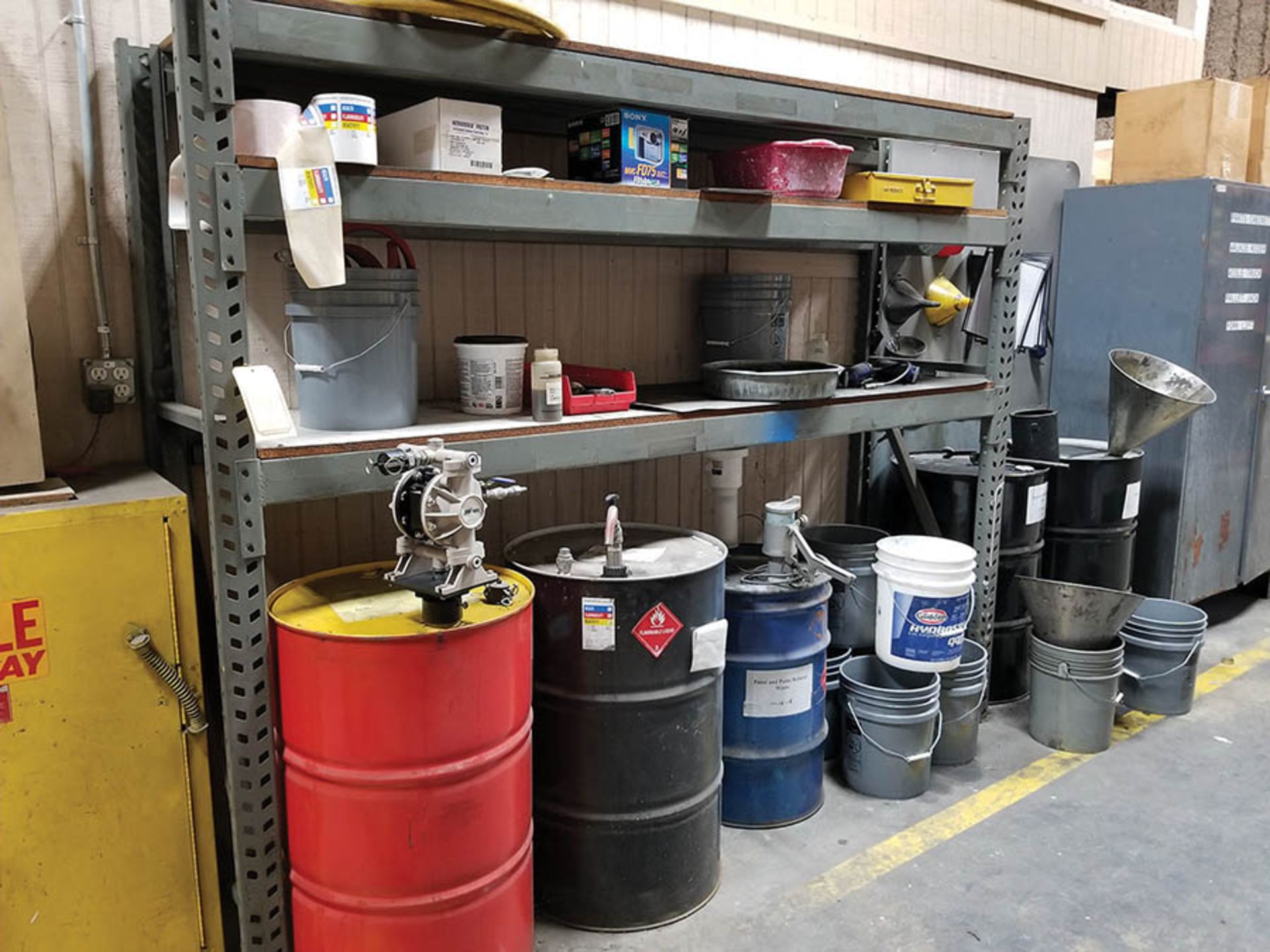 SECTION OF 8' X 2' X 82'' ADJUSTABLE RACK WITH (5) BARRELS OF ASSORTED OIL, (4) ZERK GREASE GUNS,