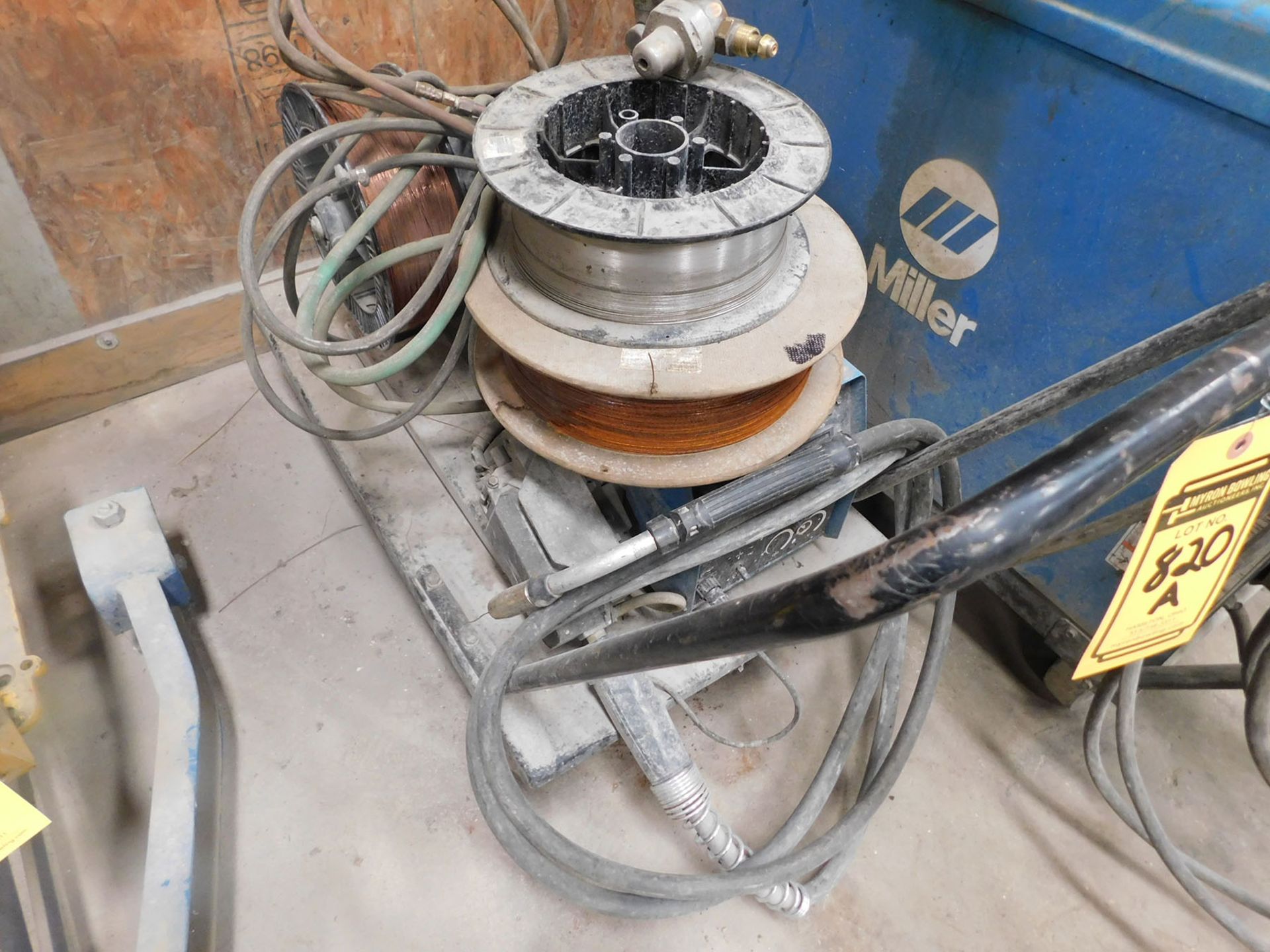 MILLER WIRE FEEDER ON ROLLING CART WITH WIRE