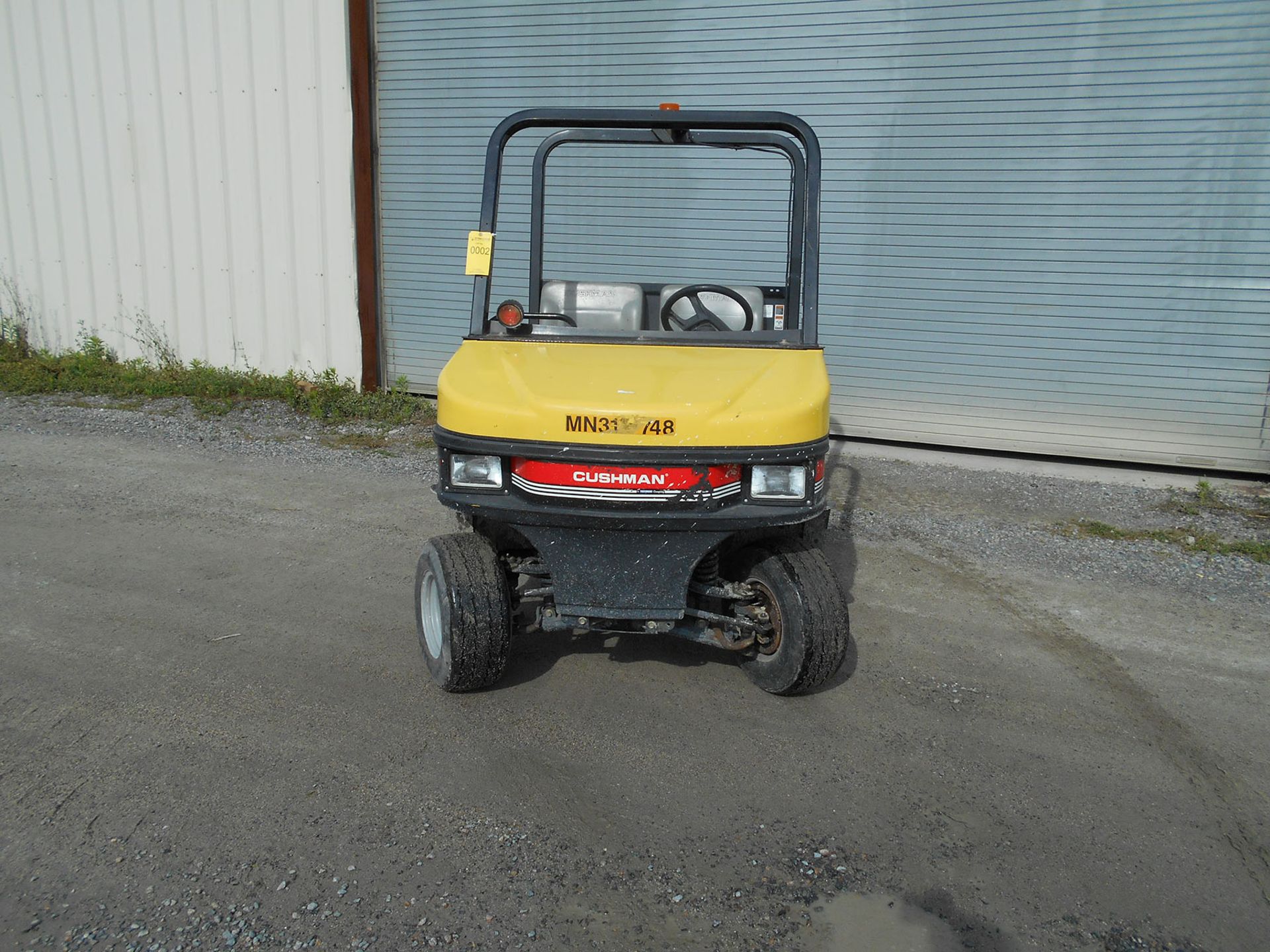 CUSHMAN GAS POWERED 2-SEATER CART WITH BED