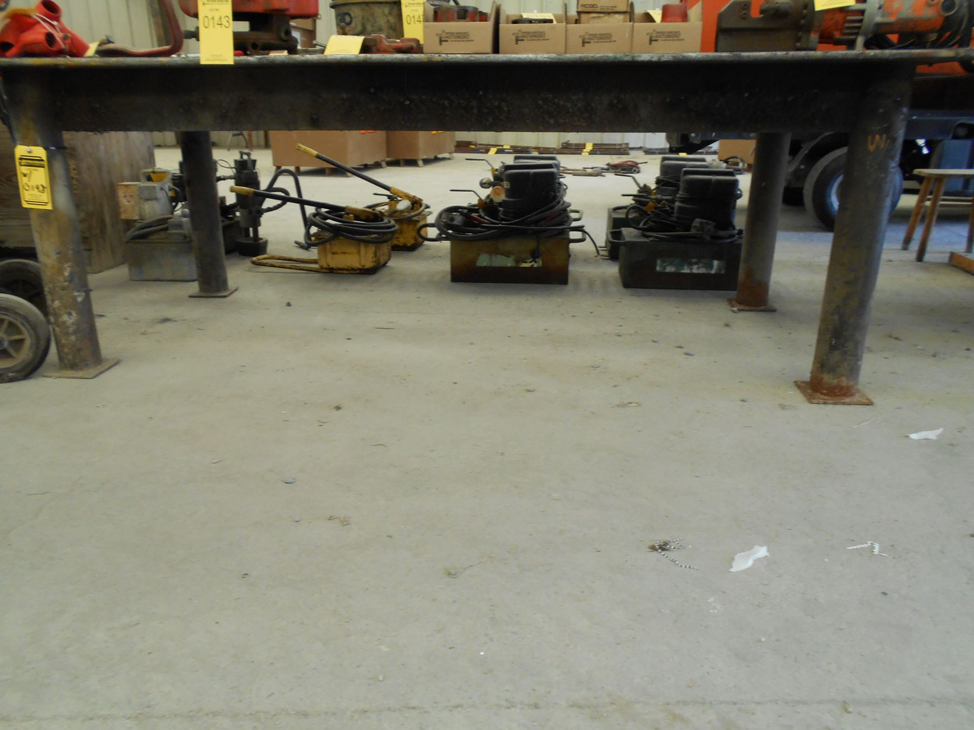 (2) HEAVY DUTY STEEL SAWHORSES, STEEL PLATE, AND (2) STEEL WORKTABLES