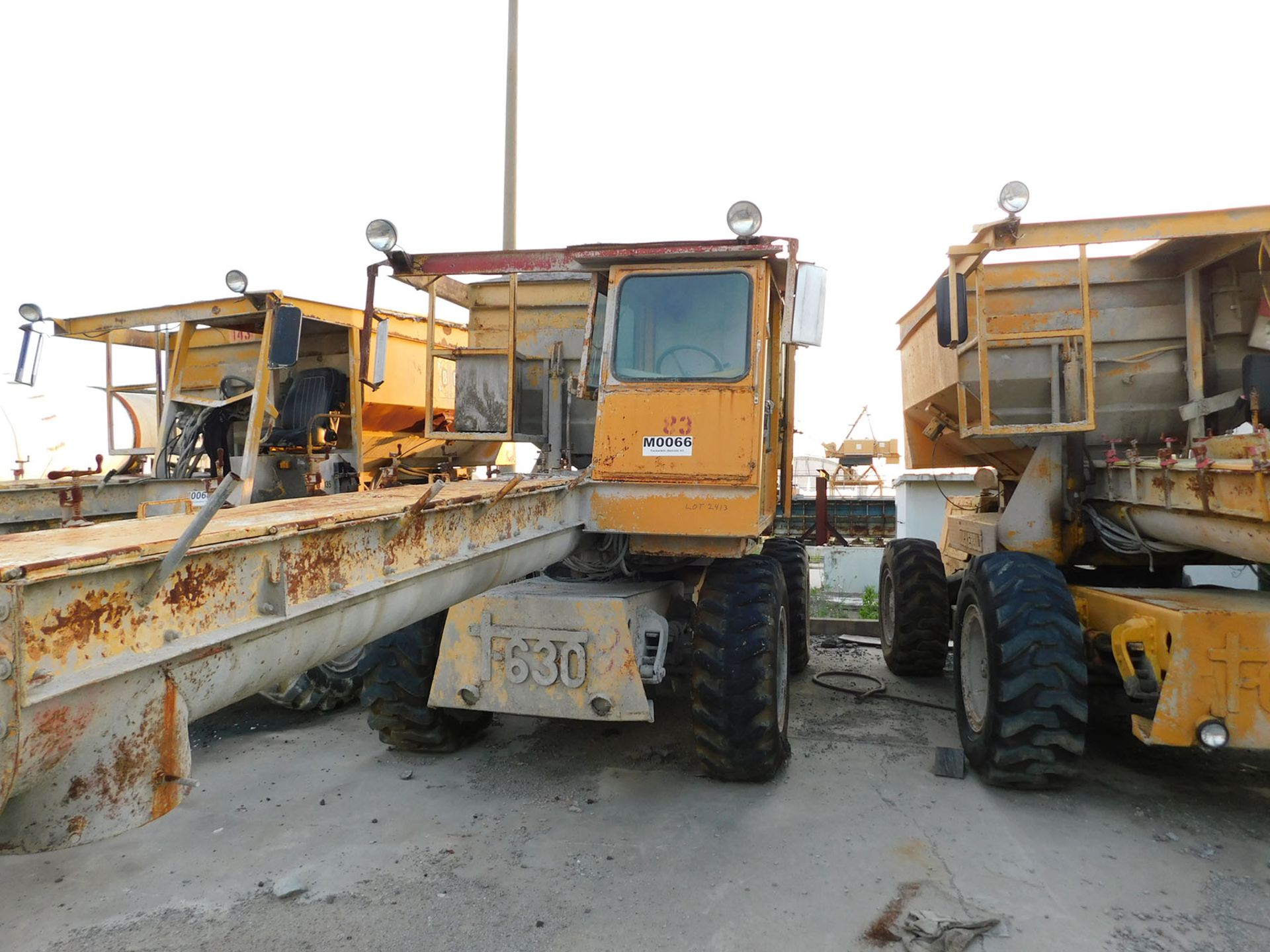 TUCKER BILT T630 CONCRETE TRANSPORT VEHICLE 6-YARD HOPPER, HYDRAULIC SWING, 3 SPEED AUGER, DIESEL