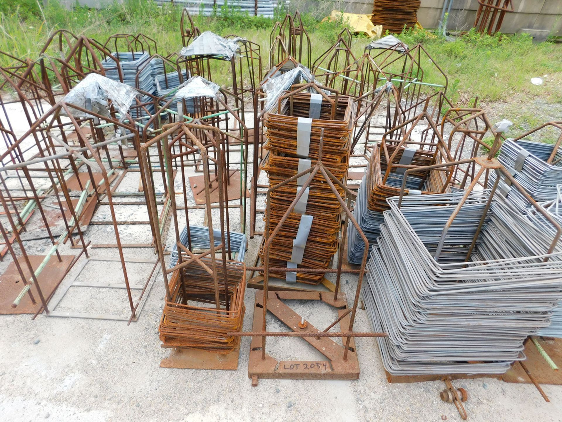 LOT OF MISC. WIRE & STEEL ALONG RETAINER WALL)