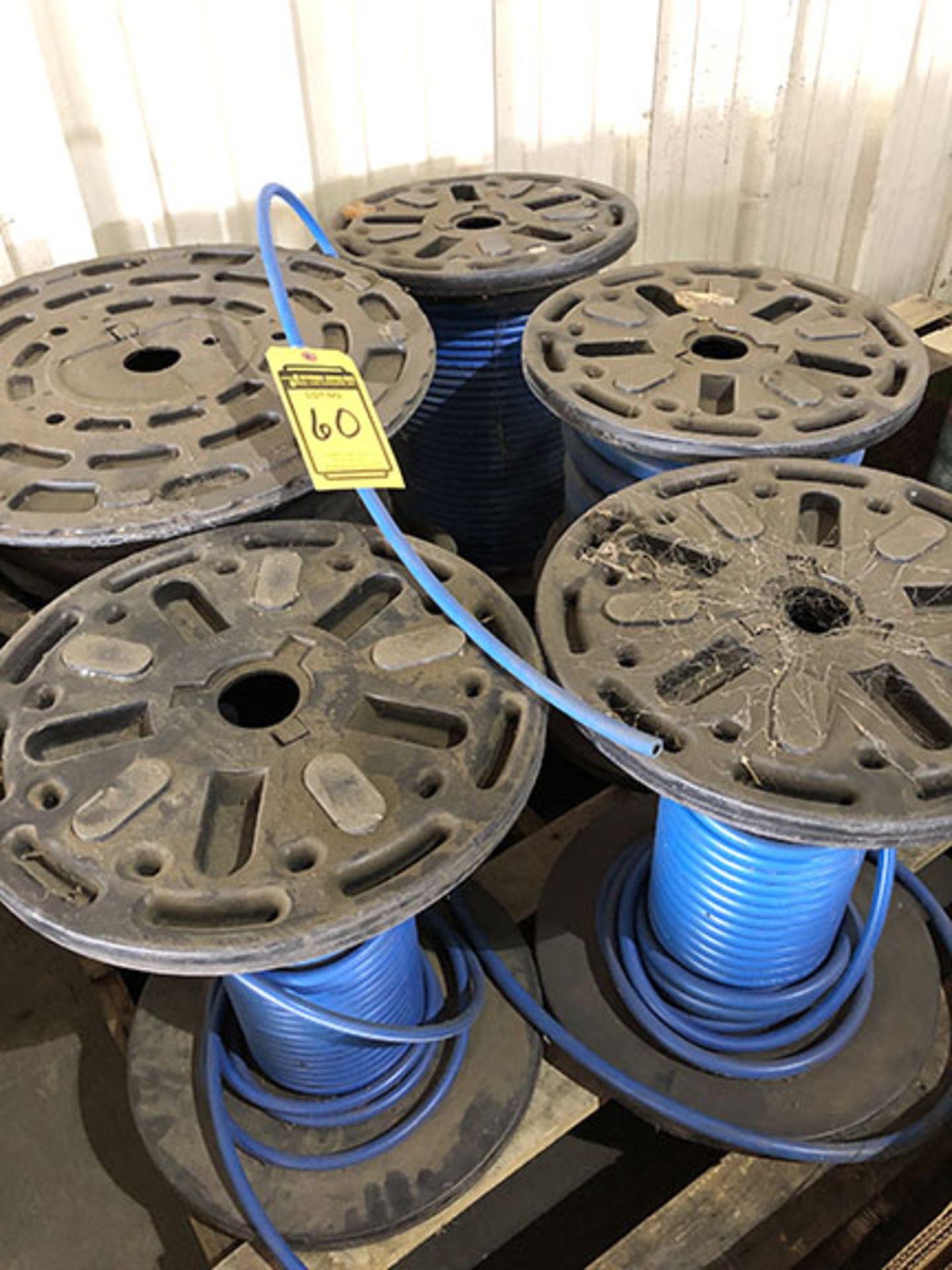 PALLET OF (5) SPOOLS OF 1/4", 3/8" PNEUMATIC HOSE, AND 3/4" HYDRAULIC HOSE