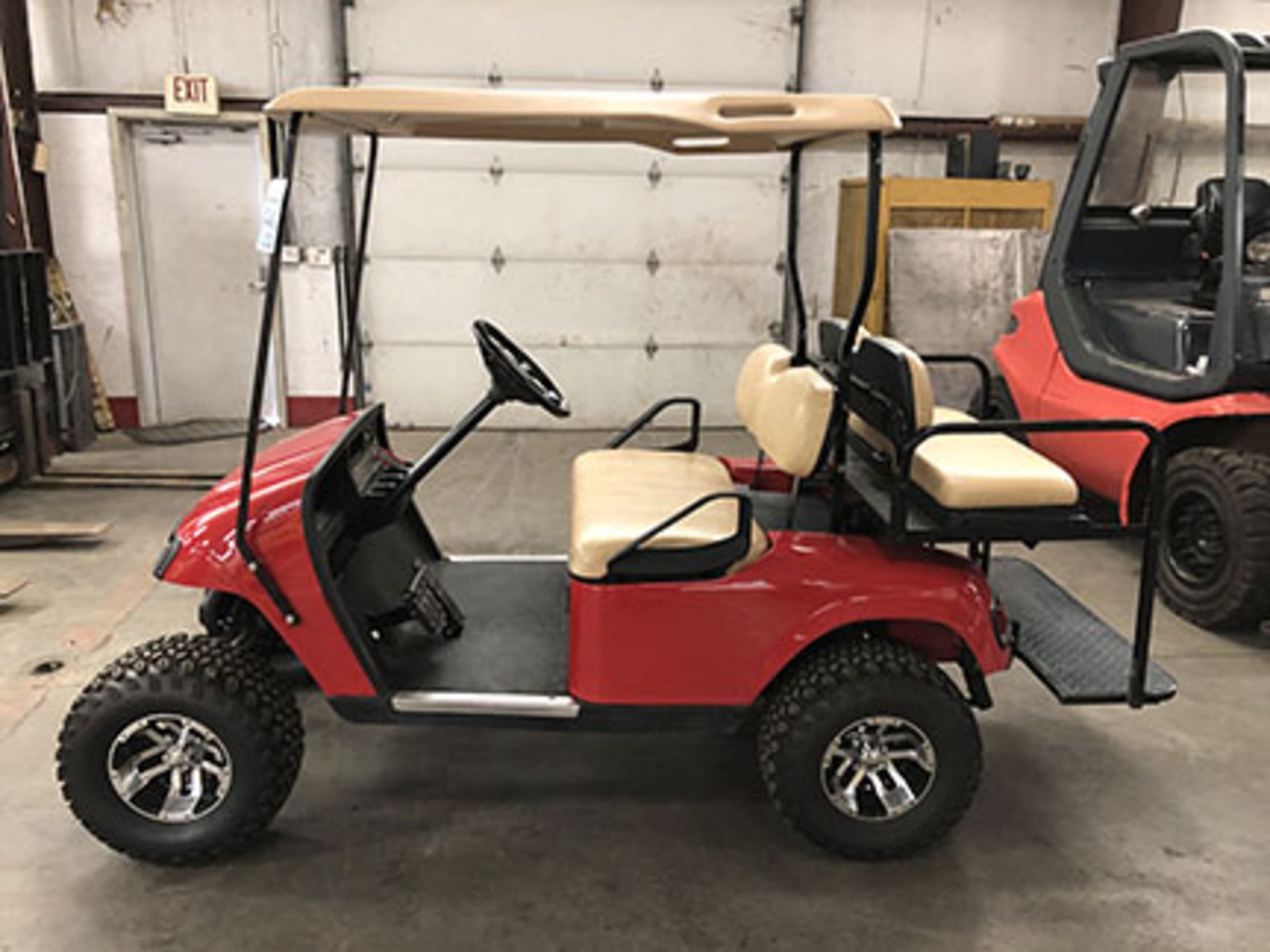 2012 EZ GO ELECTRIC GOLF CART, WITH 36 VOLT CHARGER, 4-PASSENGER FOLD DOWN SEAT, LIFT