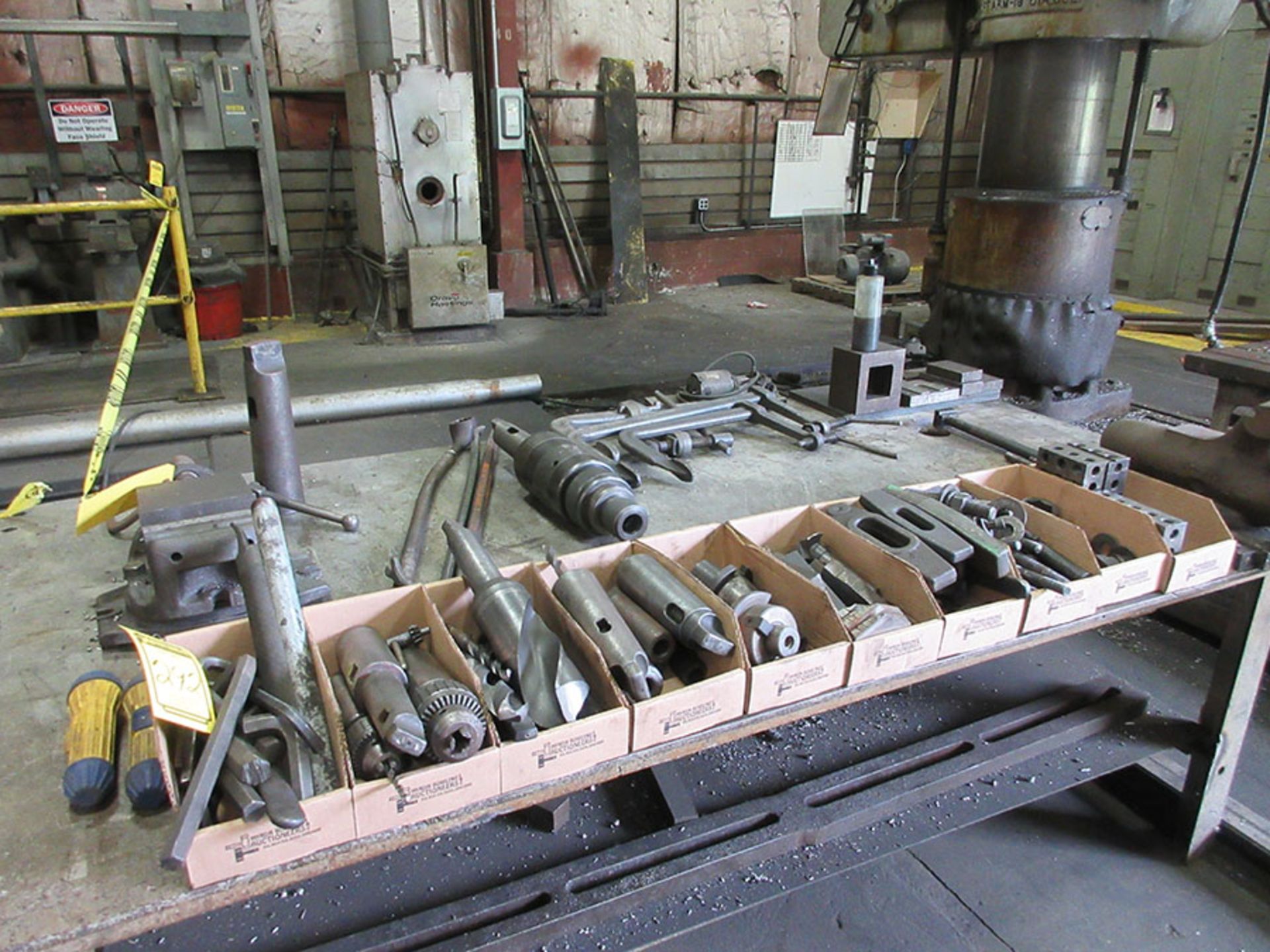 CONTENTS OF TABLE; BRIDGEPORT 6'' MACHINE VISE, TAPER TOOLS, HOLD DOWNS, AND DRILL BITS