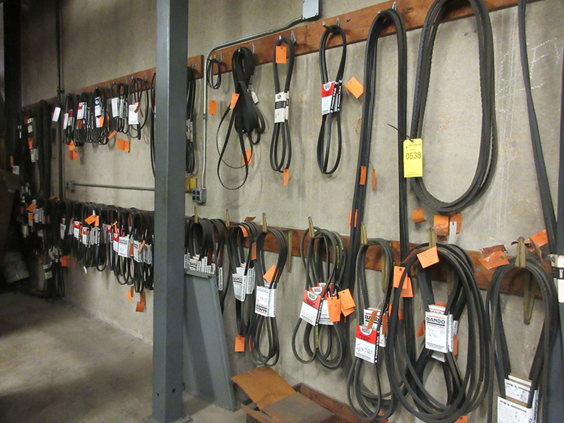 ASSORTED V-BELTS ON WALL
