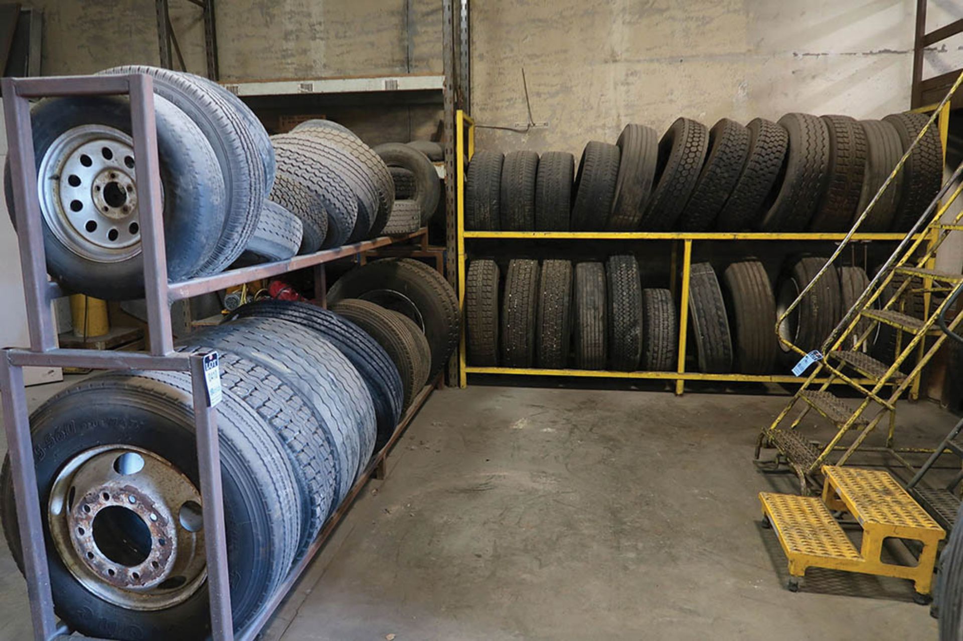 (LOT) MISC. CAR AND TRUCK TIRES WITH RACKS ***LOCATED IN MIDLAND, MICHIGAN**