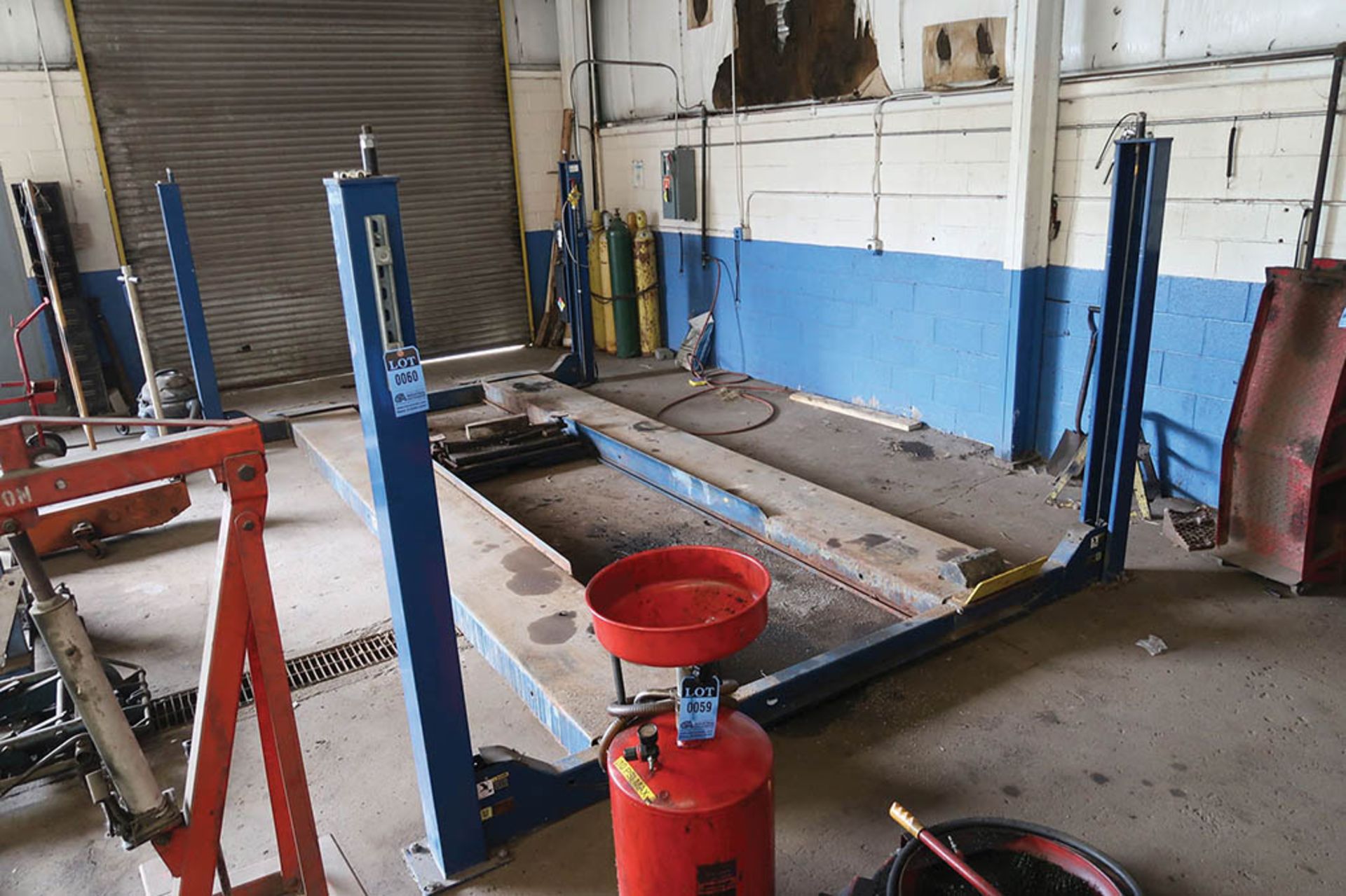 12,000 LB. CAPACITY HYDRAULIC FOUR-POST ROTARY MODEL SM122-3 DRIVE-ON VEHICLE LIFT; S/N