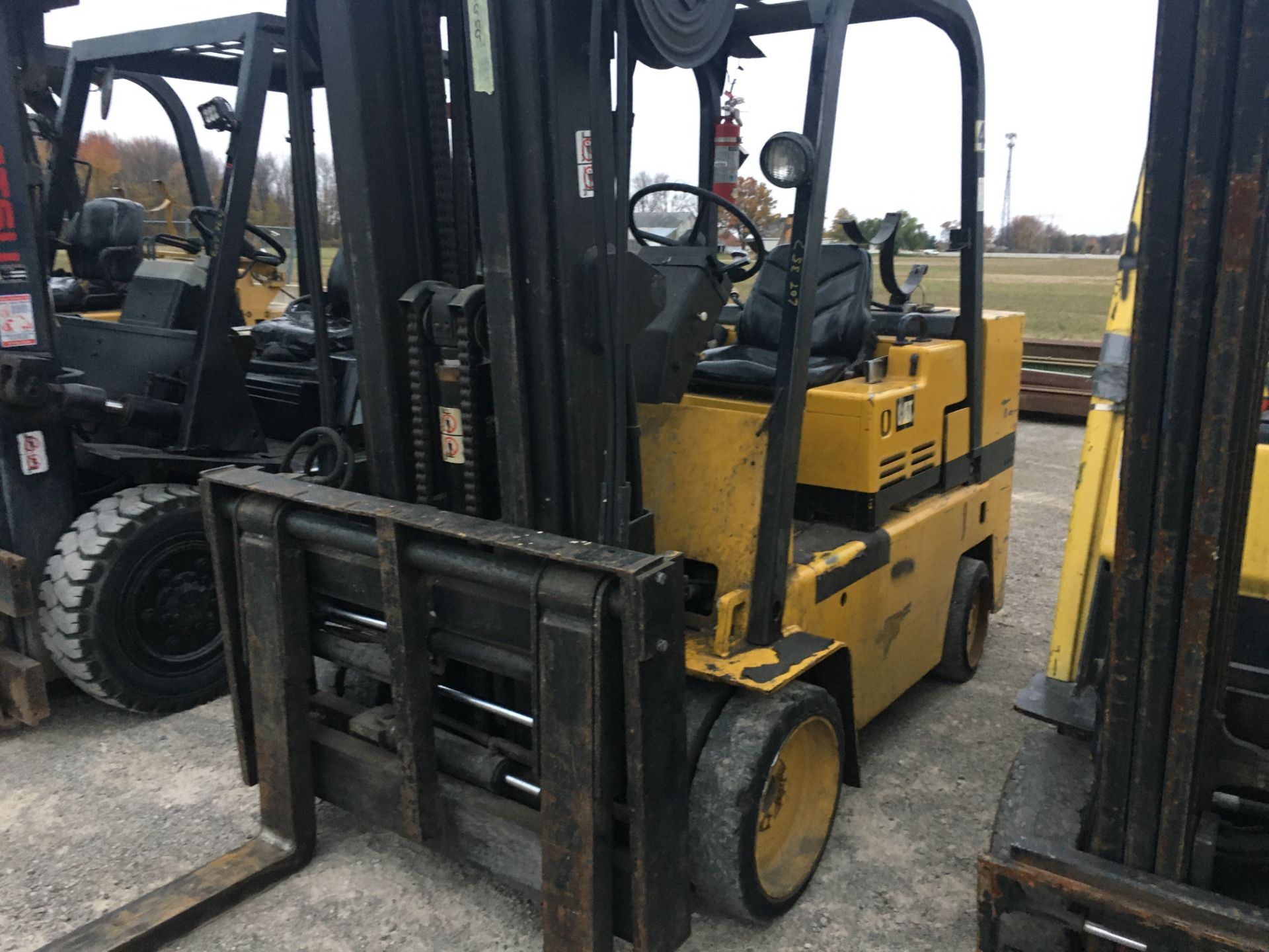 CAT 10,000 LB. CAPACITY FORKLIFT, MODEL T120C, LP, 3-STAGE MAST, POWER FORK POSITION, CUSHION TIRES