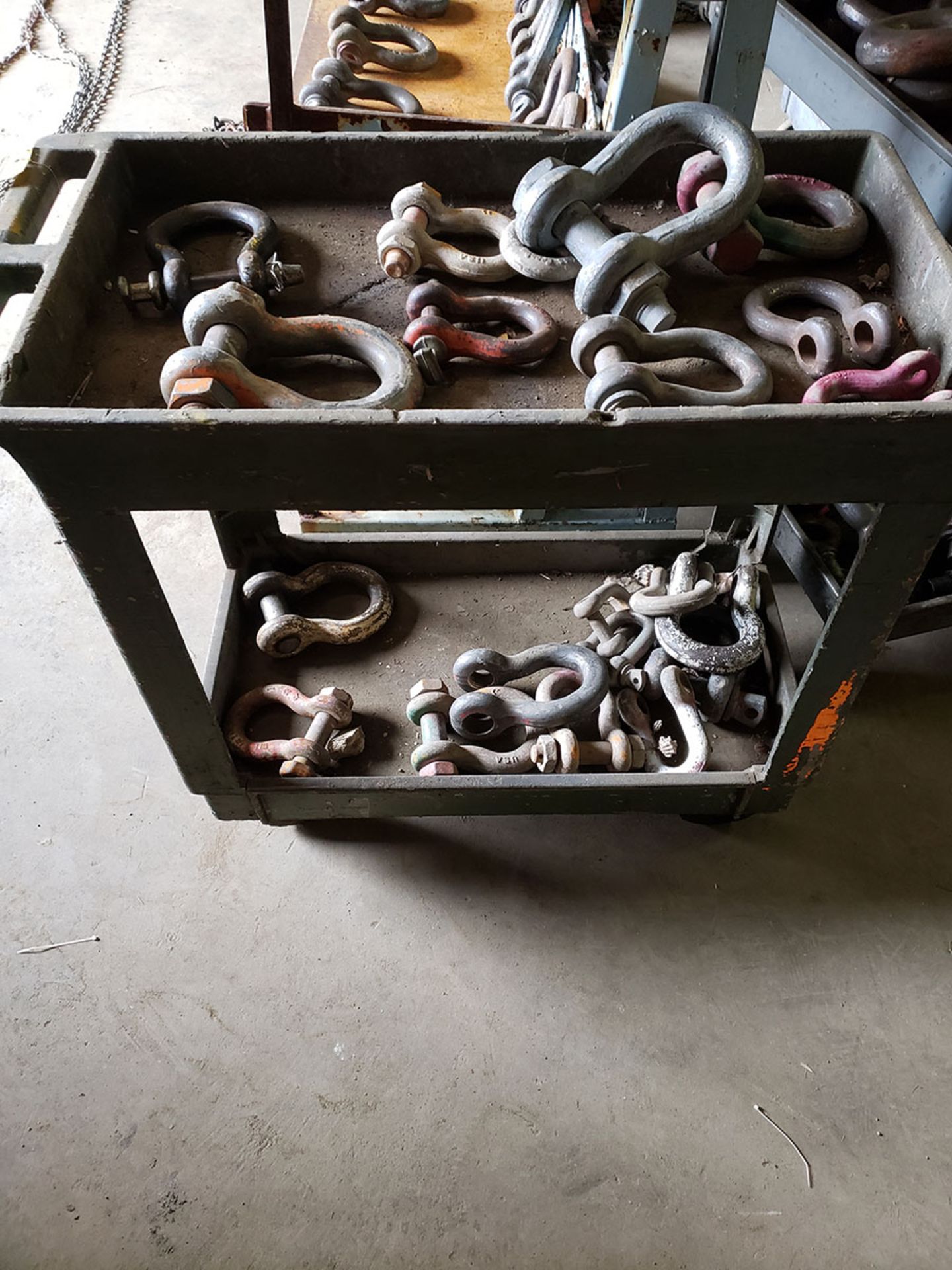 (2) ROLLING RACKS OF ASSORTED SHACKLES