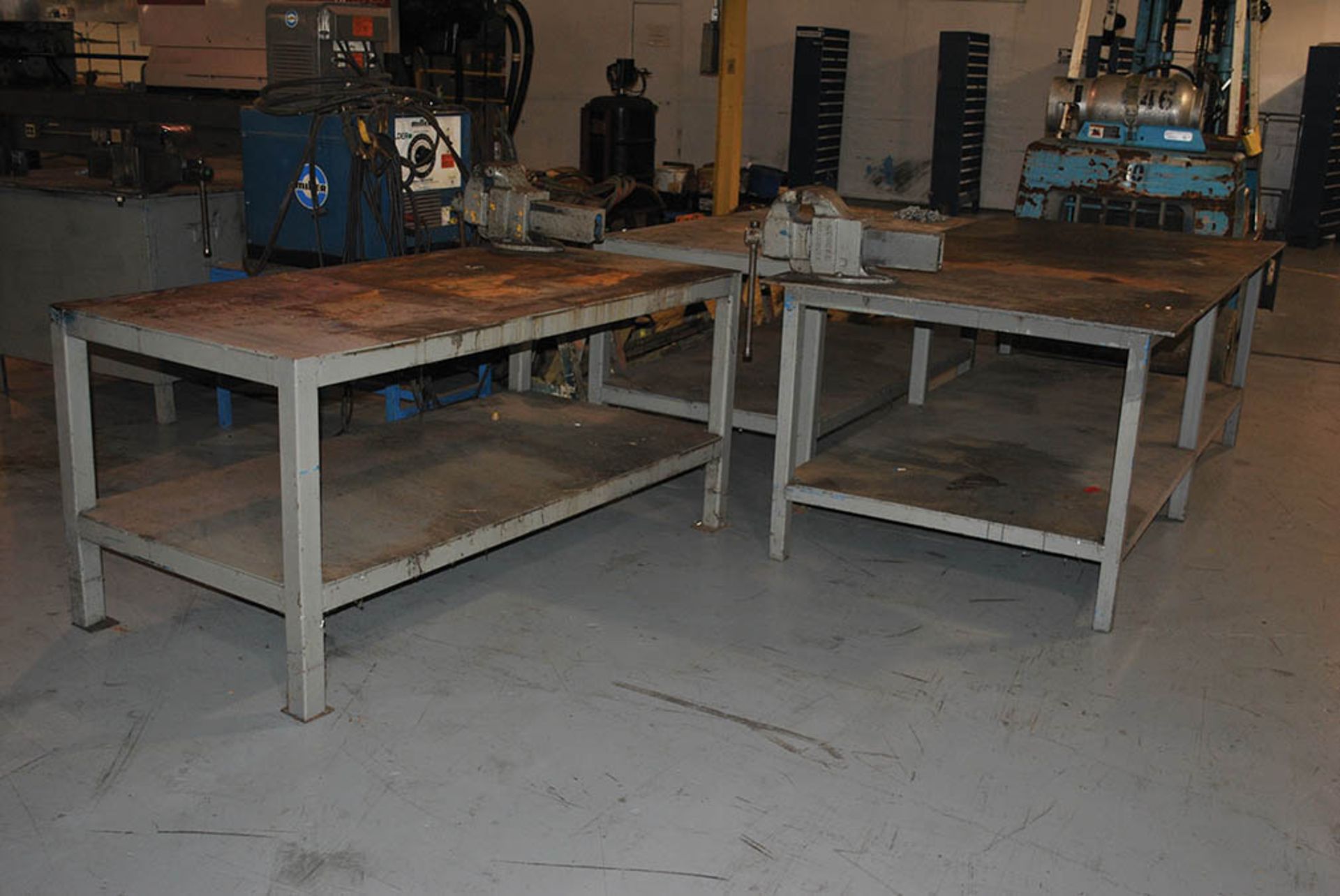 (3) 3' X 6' X 3'H STEEL WORKTABLES, (2) W/VISES