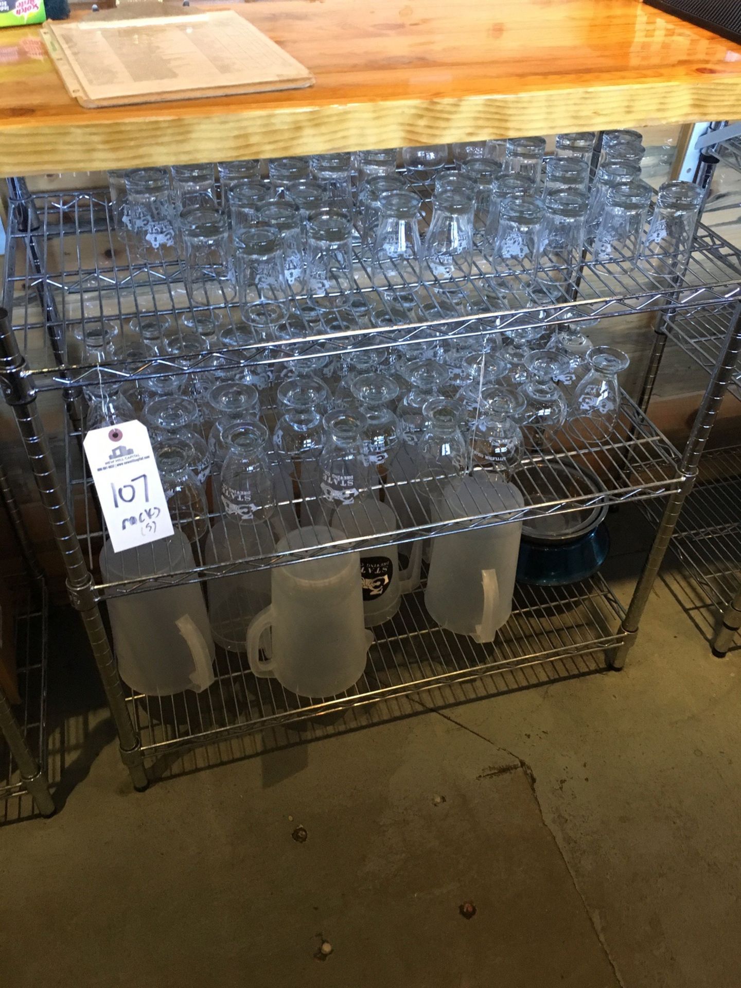 Glassware on Racks in Lot 107 | Rig Fee: $110